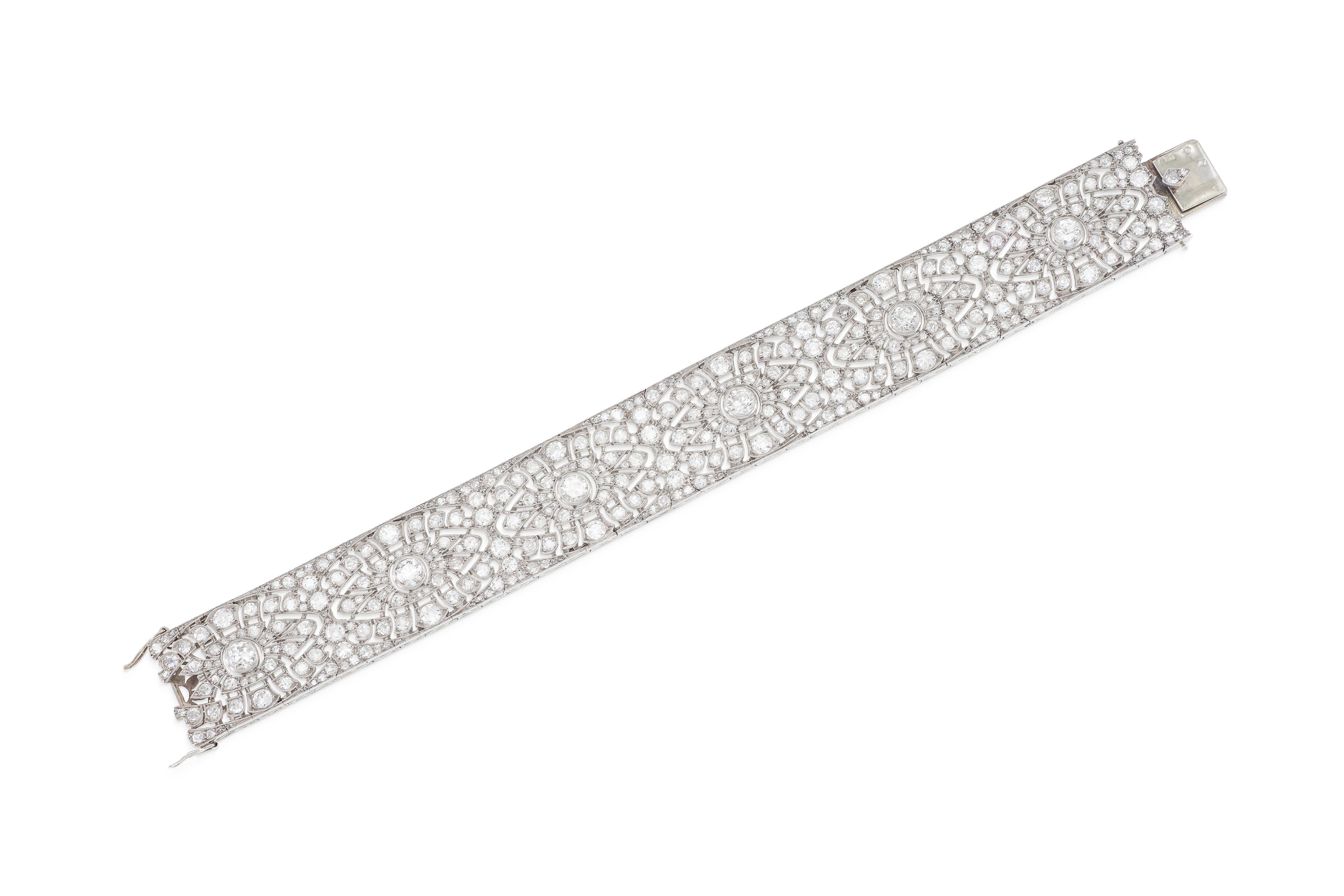 Finely crafted in platinum with Old European cut Diamonds weighing a total of approximately 25.00 carats.
Circa 1920s
Made in France
7 x 3/4 inches