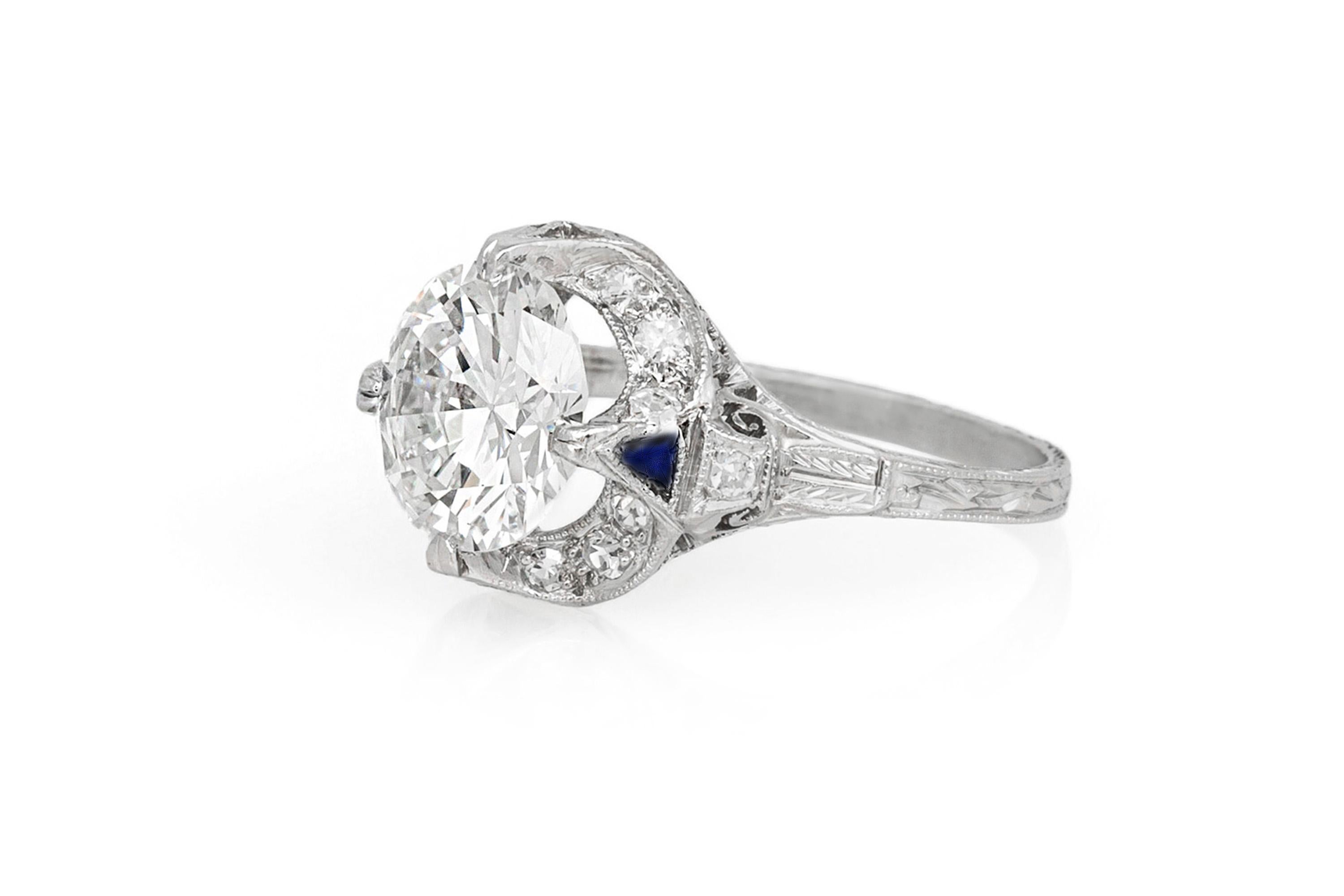 Finement réalisé en platine avec un diamant de taille européenne au centre pesant environ 2,65 carats, couleur H, pureté VS1.
La bague est ornée de diamants plus petits pesant au total environ 0,30 carat et de saphirs de taille trillion.
Circa