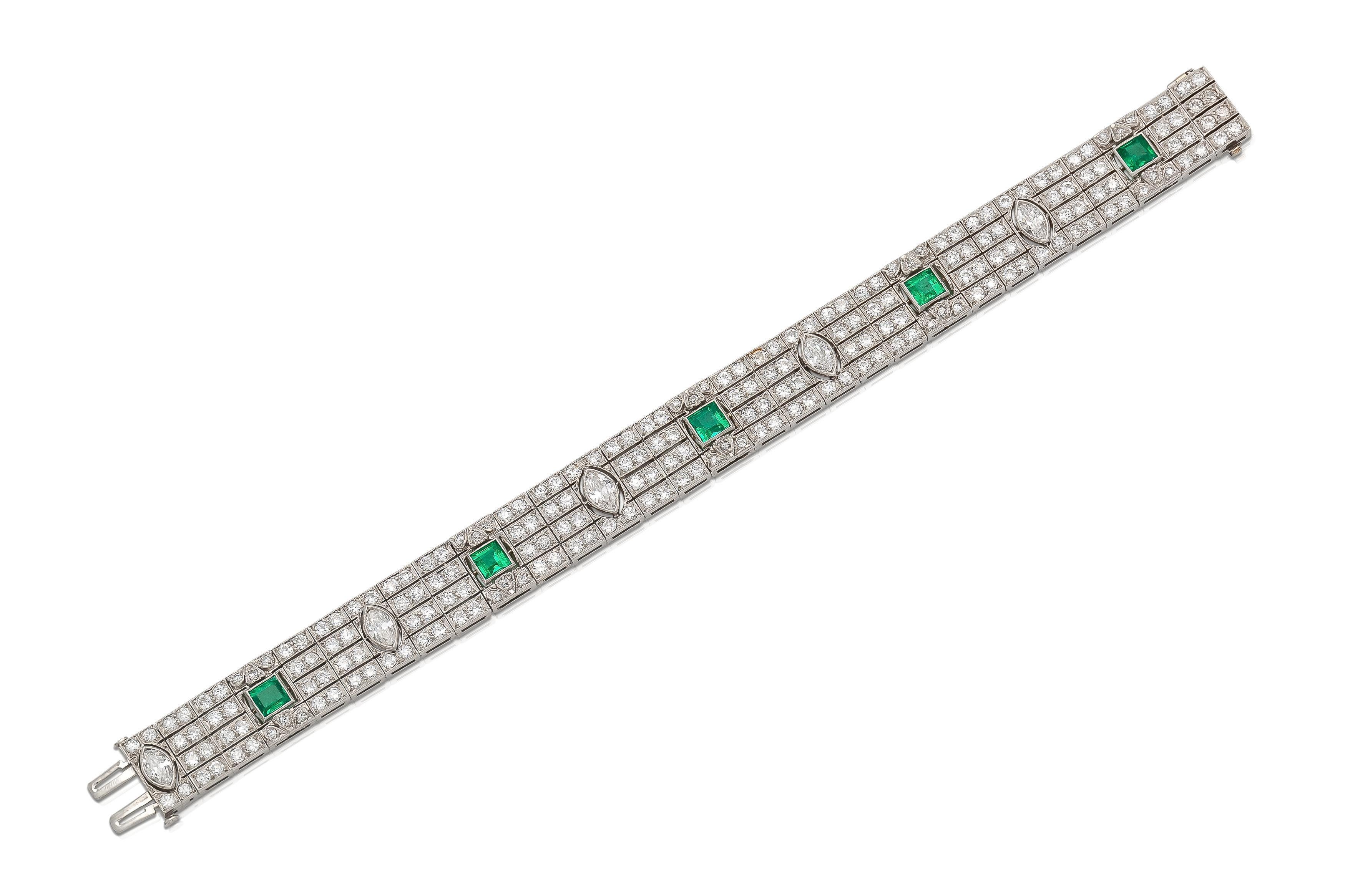 Finely crafted in platinum with 5 Square cut Emerald weighing approximately a total of 4.00 carats, 5 Marquise cut Diamonds weighing approximately a total of 2.00 carats, and 200 small Round cut diamonds weighing approximately a total of 12.00