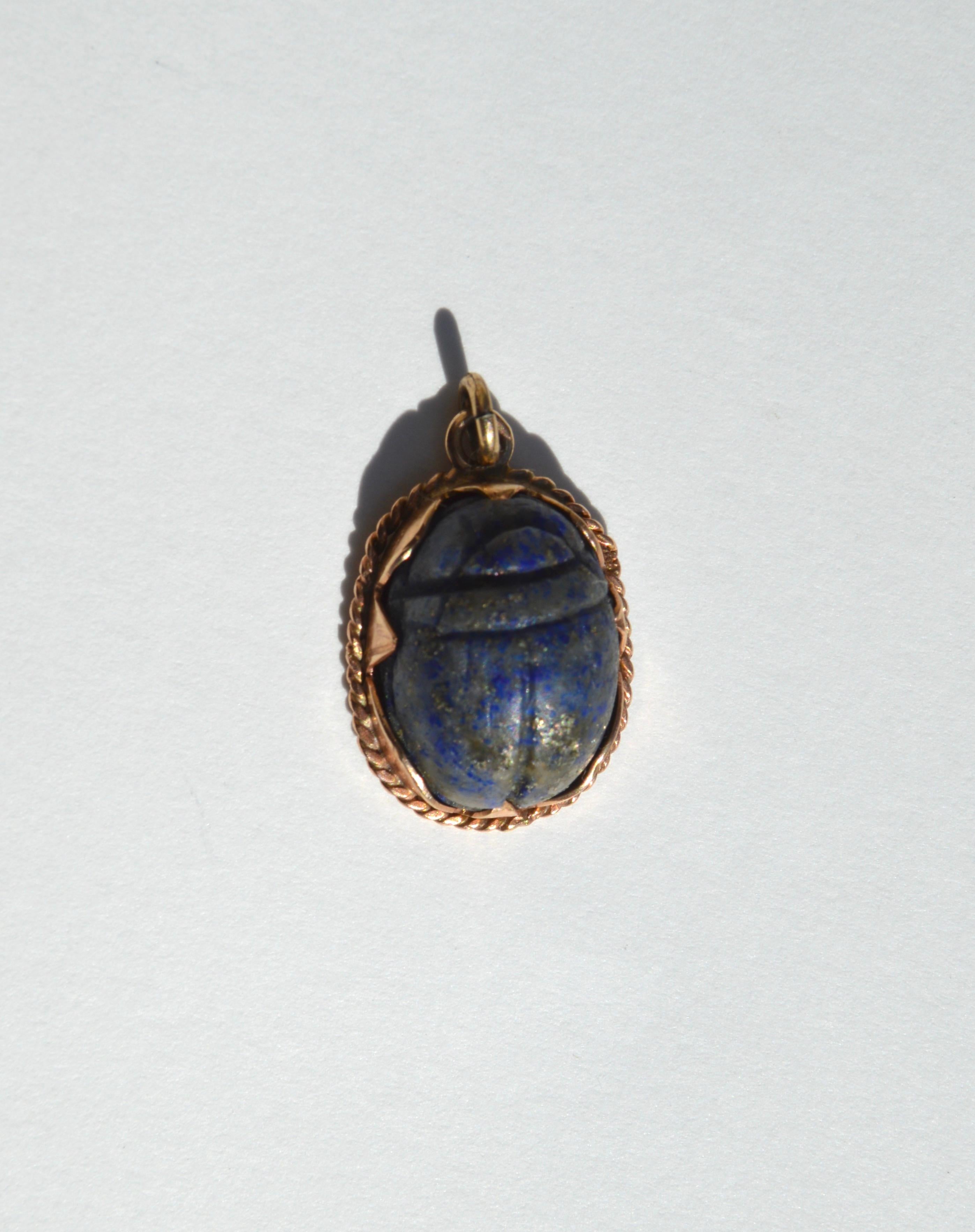 Lovely circa 1920s Art Deco era lapis lazuli Egyptian revival 14K rose gold scarab beetle charm. Scarab measures 3/4