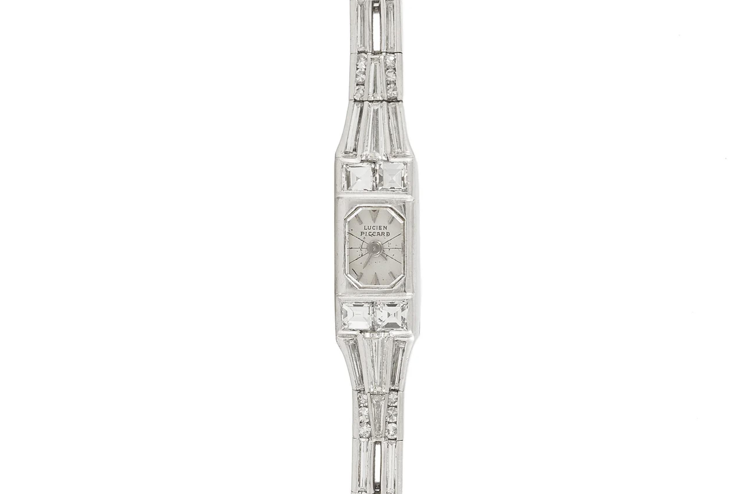 Finely crafted in platinum with Square, Baguette, and Round cut Diamonds weighing approximately a total of 10.00 carats.
The crystal of the dial is a thin cut Diamond.
Signed by Lucien Piccard
Circa 1920s
Size 6 5/8 inches