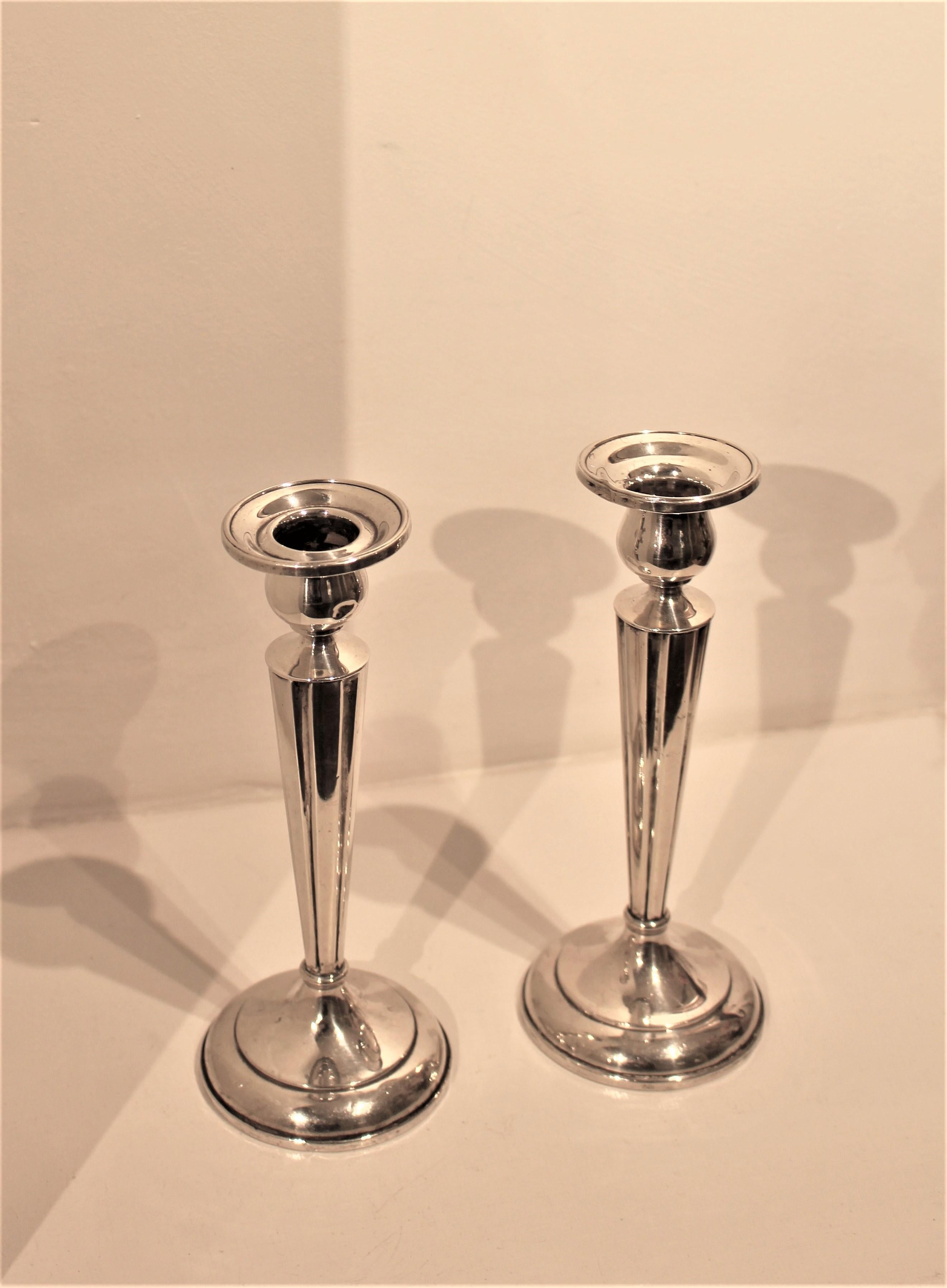 This is a lovely pair of Art Deco sterling silver candlesticks, manufactured by the well known Canadian silversmith 
