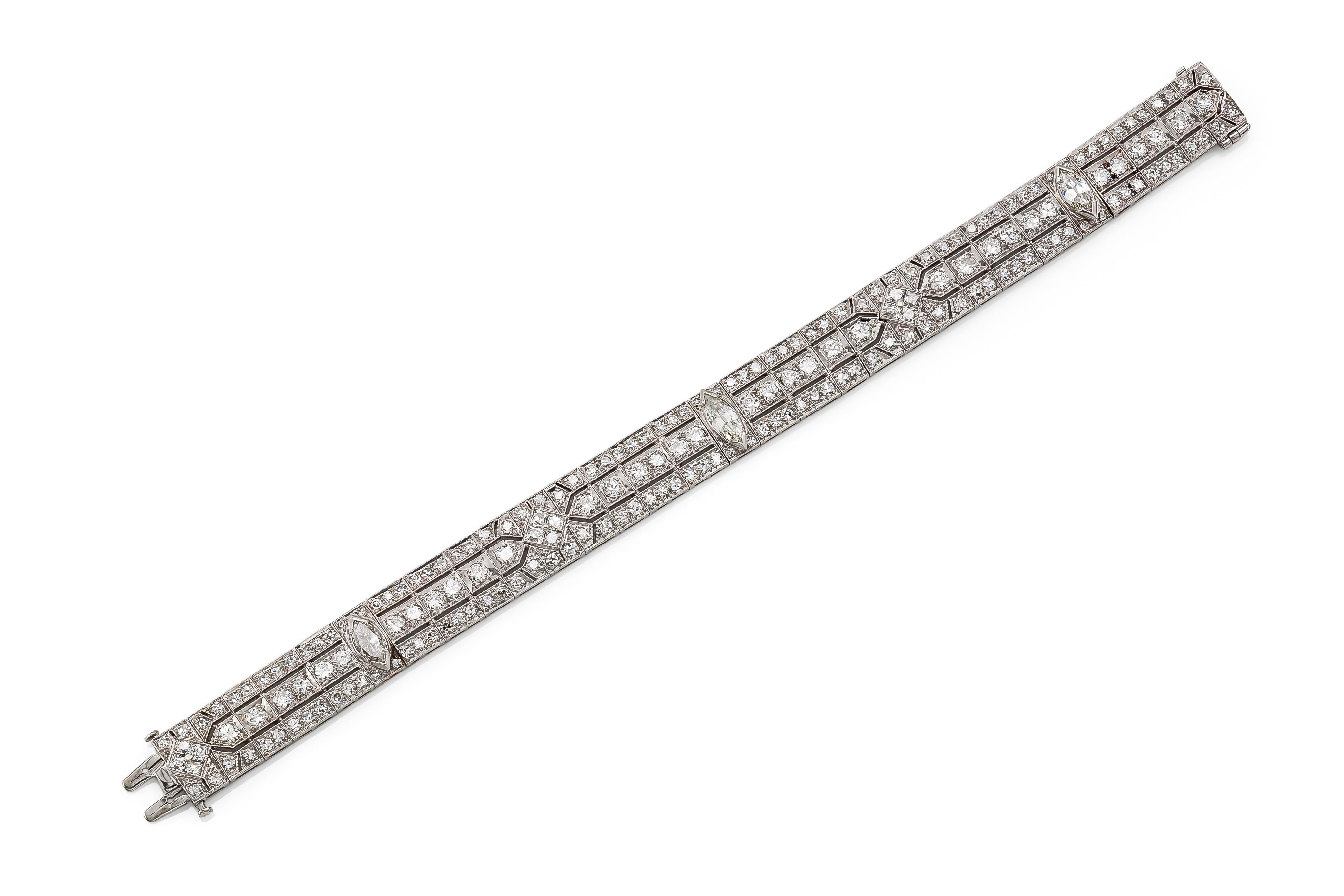 Finely crafted in platinum with 3 Marquise cut and smaller Old European and Single cut Diamonds weighing approximately a total of 12.00 carats.
CIrca 1930s
Size 7 inches
1/2 inch wide