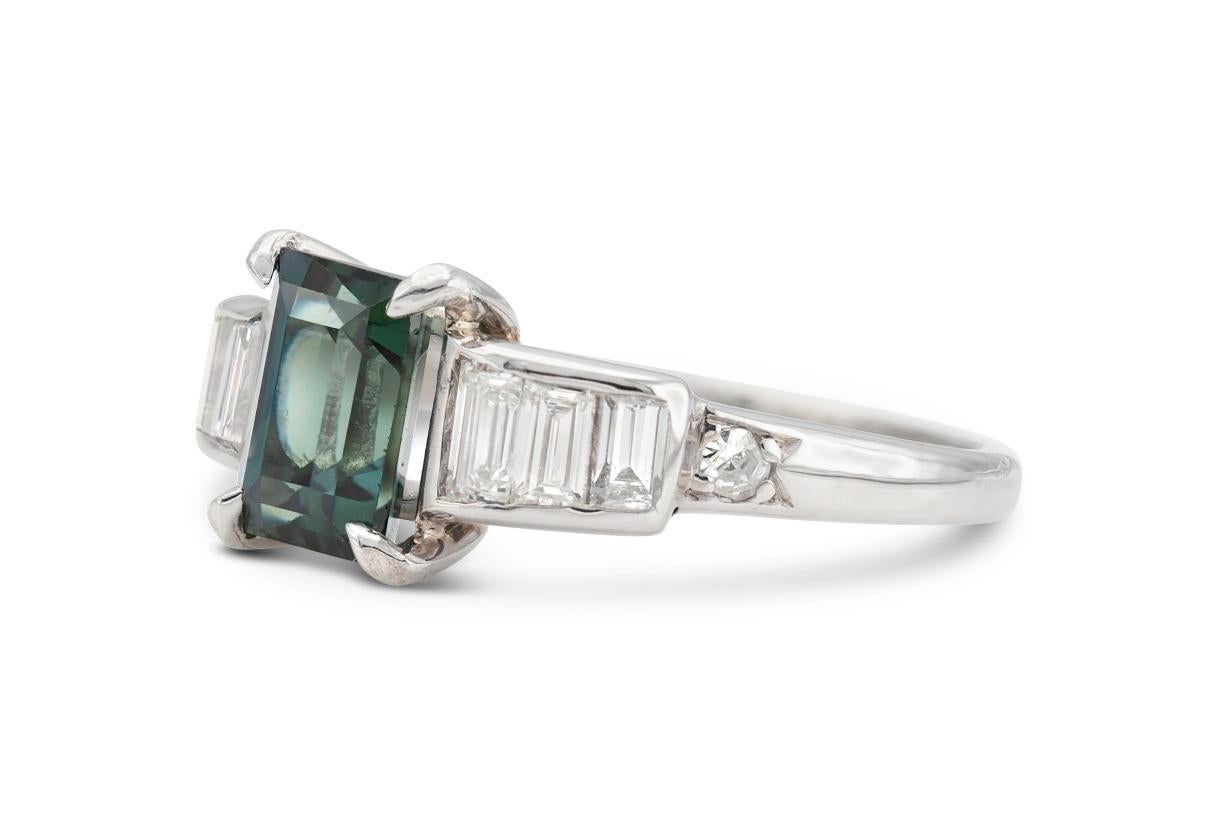 Finely crafted in platinum featuring a Green Sapphire weighing approximately 1.50 carat with side Baguette- and Old European cut Diamonds weighing a total of approximately 0.70 carat.
Circa 1930s
Size 5 1/4, resizable