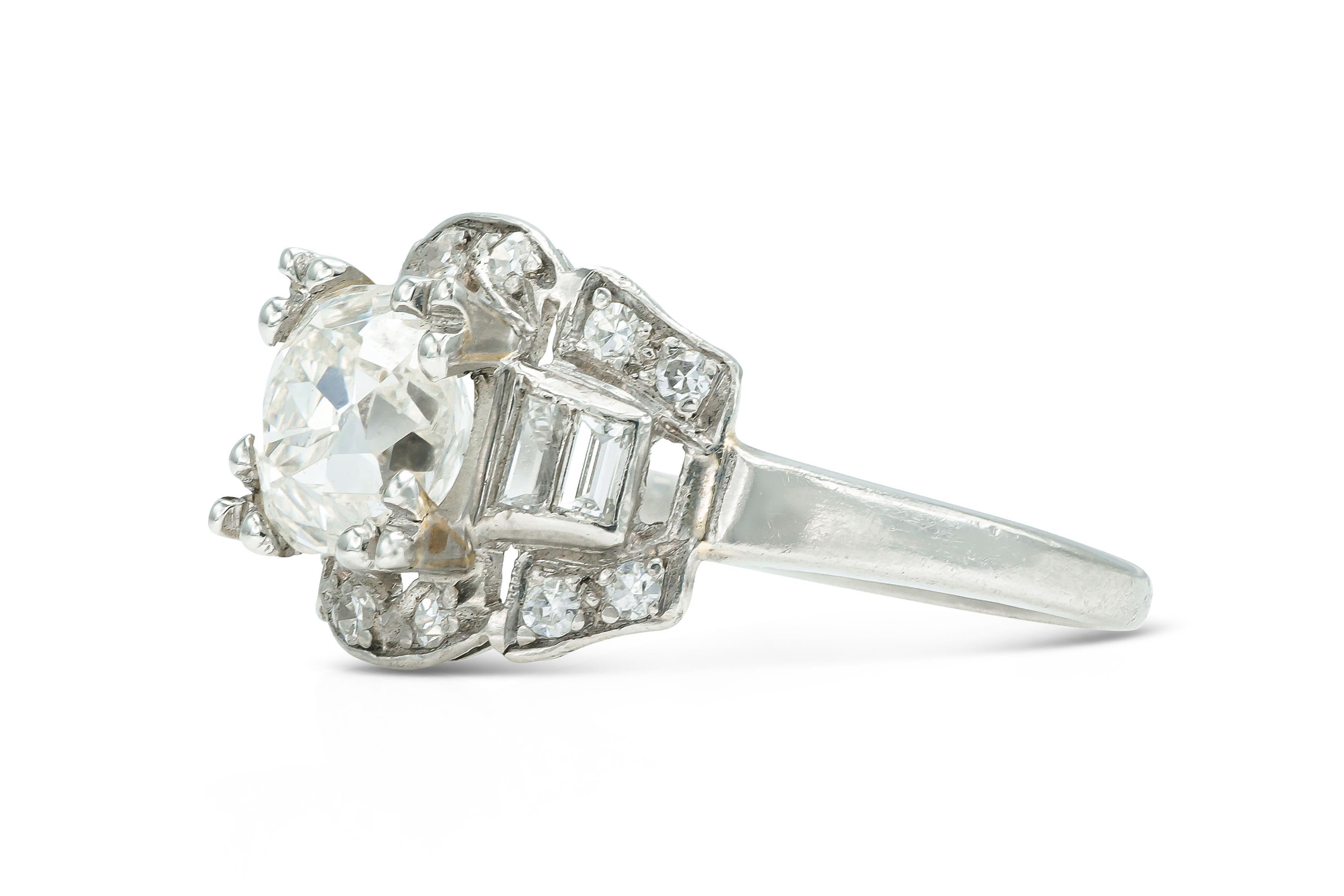 Finely crafted in platinum with an Old Mine cut Diamond at the center weighing 1.62 carats, I color, SI1 clarity.
The ring features accenting Baguette and Single cut Diamonds on the setting weighing a total of approximately 0.40 carat.
Circa