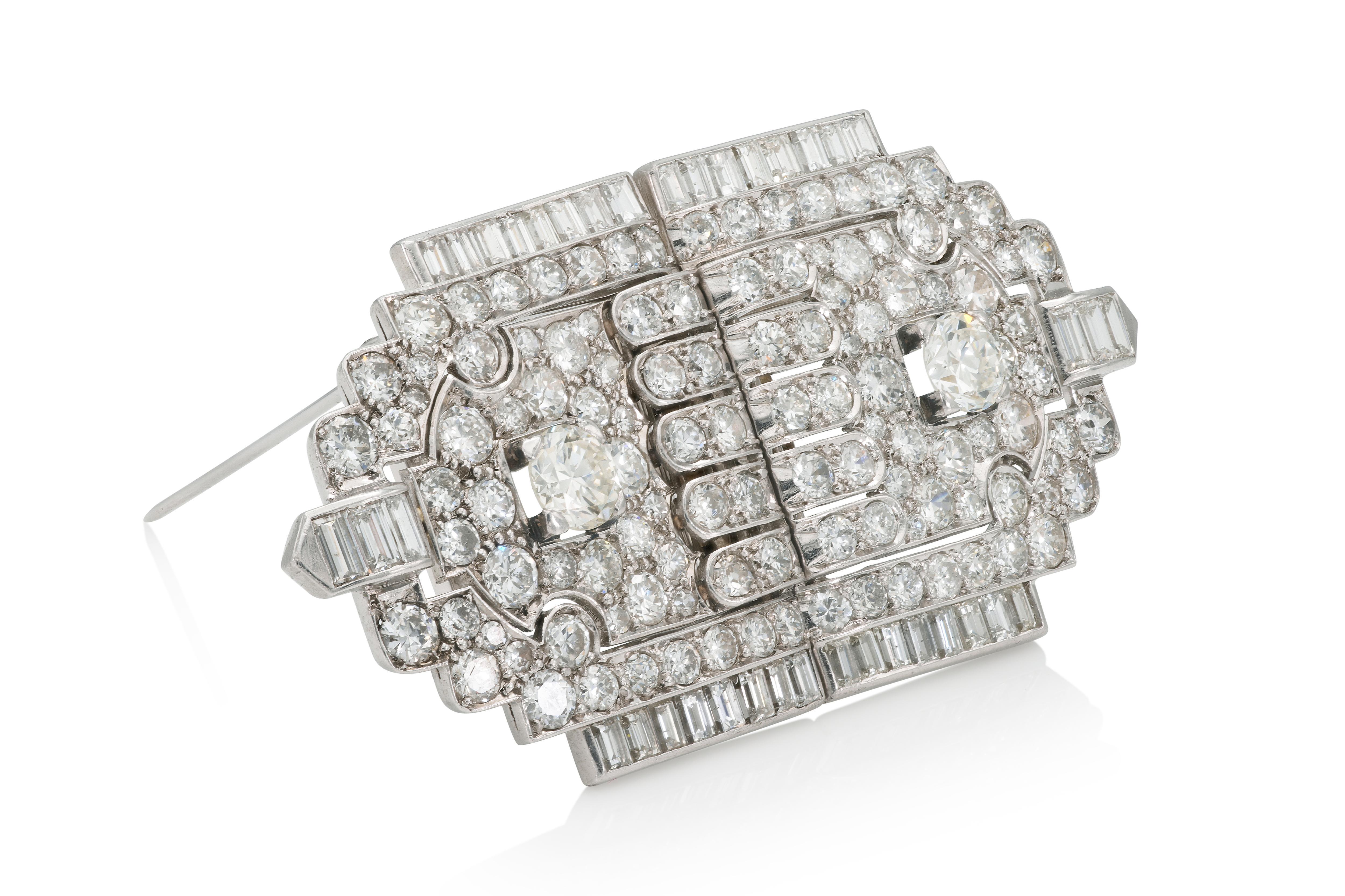 Finely crafted in platinum with 2 Old European cut center Diamonds weighing approximately a total of 2.00 carats, as well as smaller Old European and Baguette cut Diamonds weighing approximately a total of 20.00 carats.
Circa 1930s
Brooch: 2 5/8 x 1