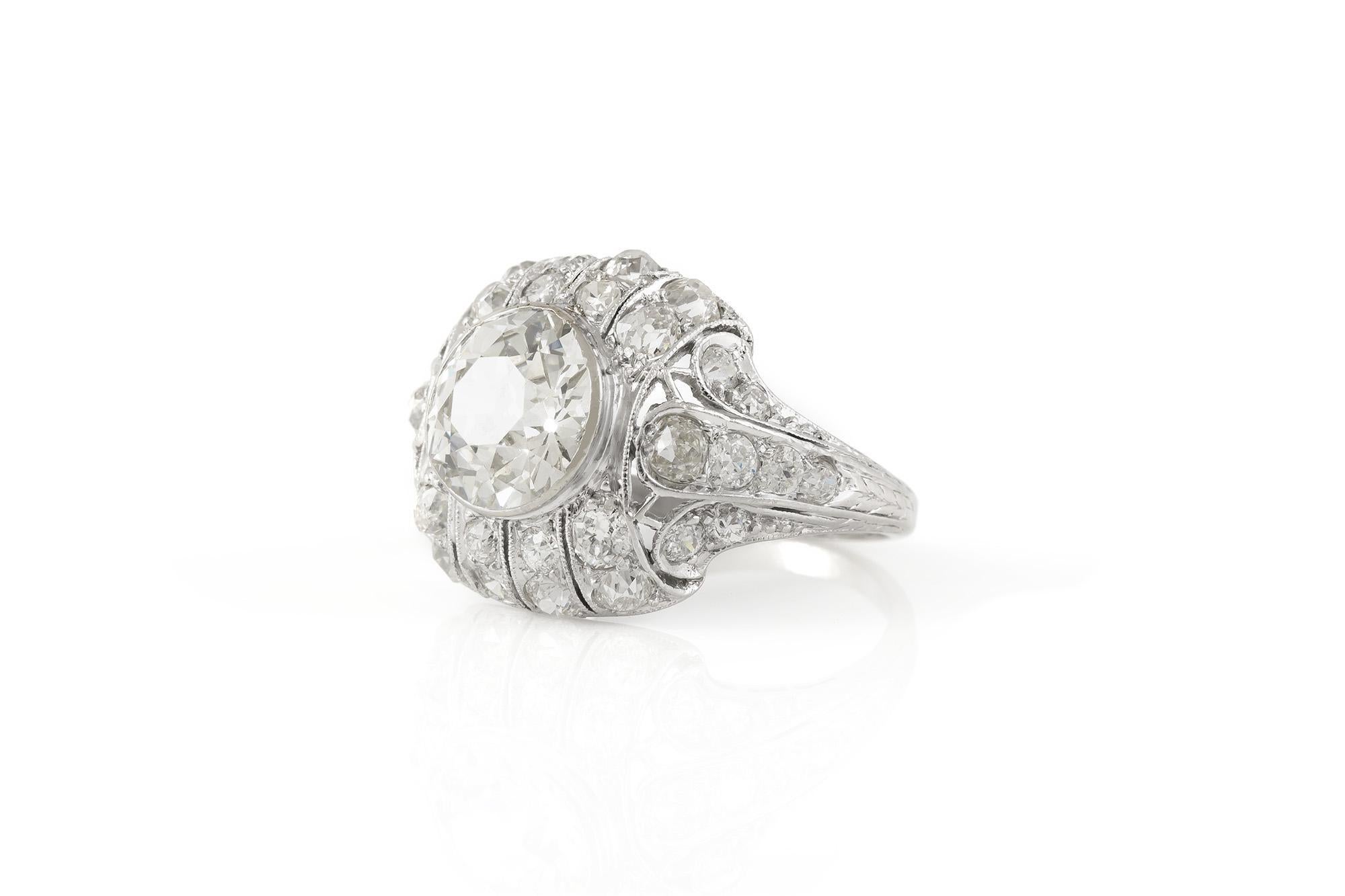 Finely crafted in platinum with an Old European cut center Diamond weighing 2.25 carats, I color, VS clarity, and accenting smaller Old European cut Diamonds weighing approximately a total of 2.00 carats.
Circa 1920s
Size 5 3/4, resizable