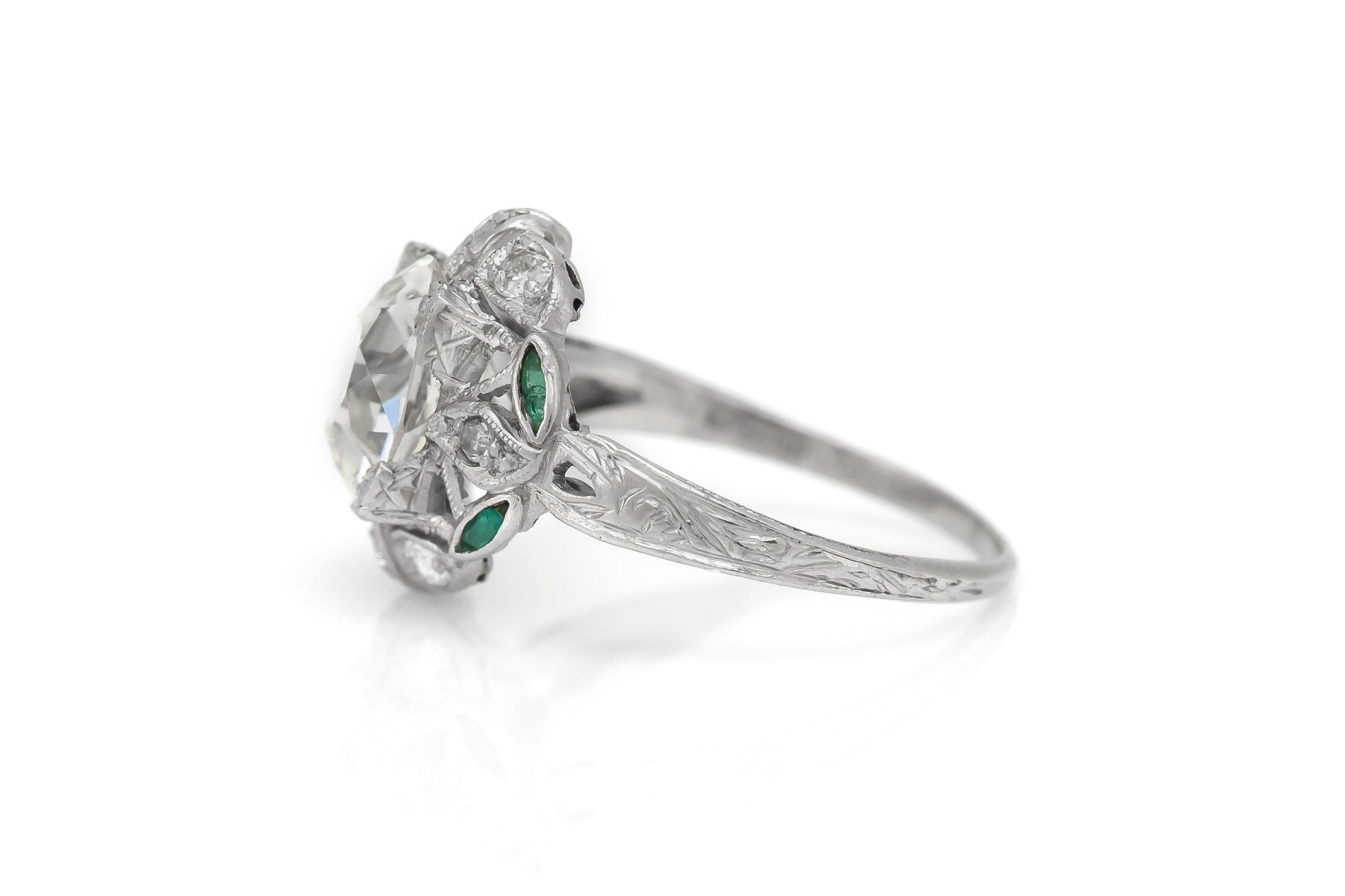 Finely crafted in platinum with an Old European cut center Diamond weighing a total of approximately 2.50 carats, J color, VS2 clarity.
The ring features 8 smaller Diamonds on the setting that weigh a total of approximately 0.24 carat.
Circa