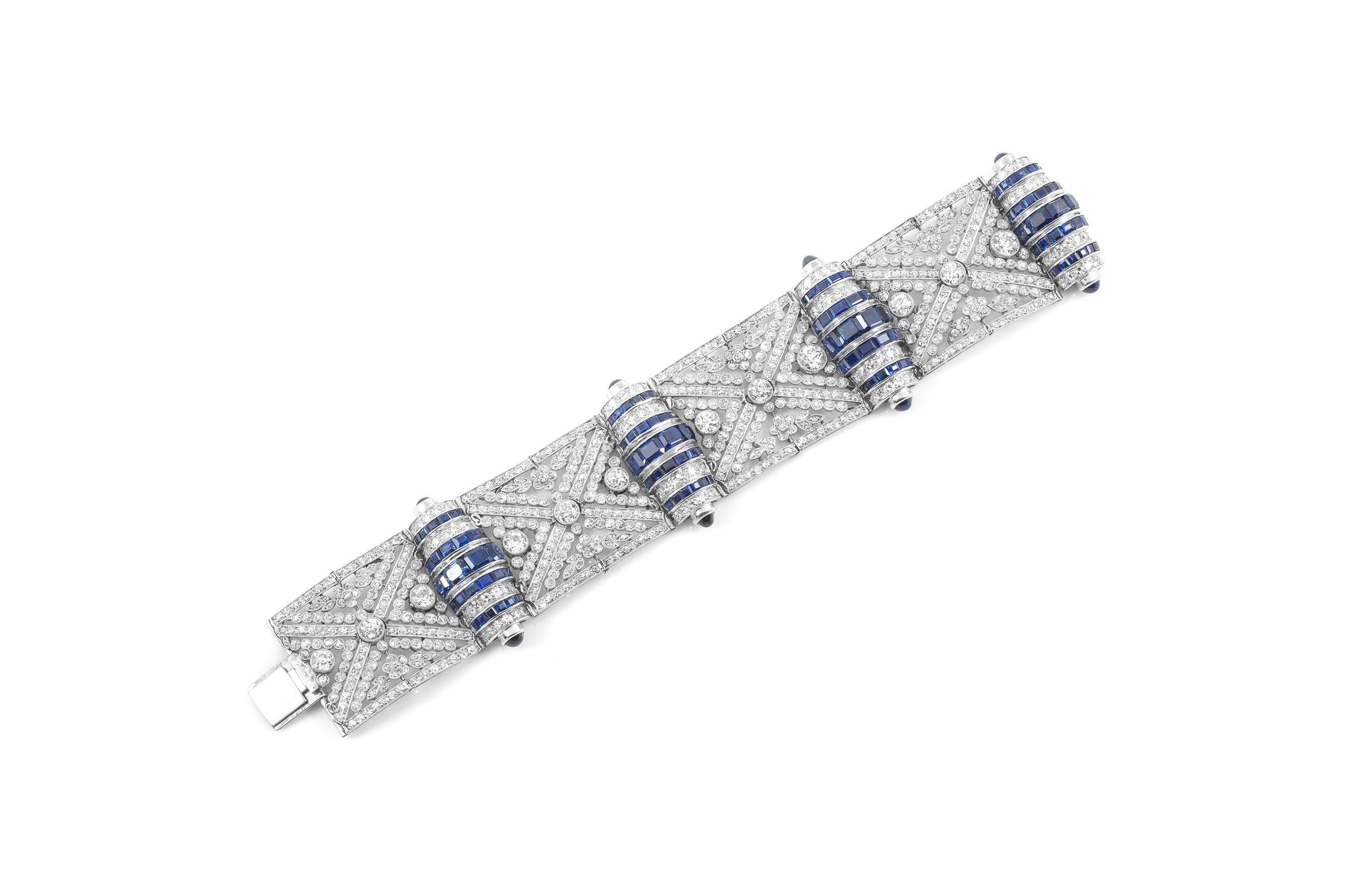Finely crafted in platinum with Old European cut Diamonds weighing a total of approximately 30.00 carats, and Rectangular cut and Cabochon Sapphires weighing a total of approximately 20.00 carats.
Circa 1930s
 6 3/4 x 1 3/8 inches