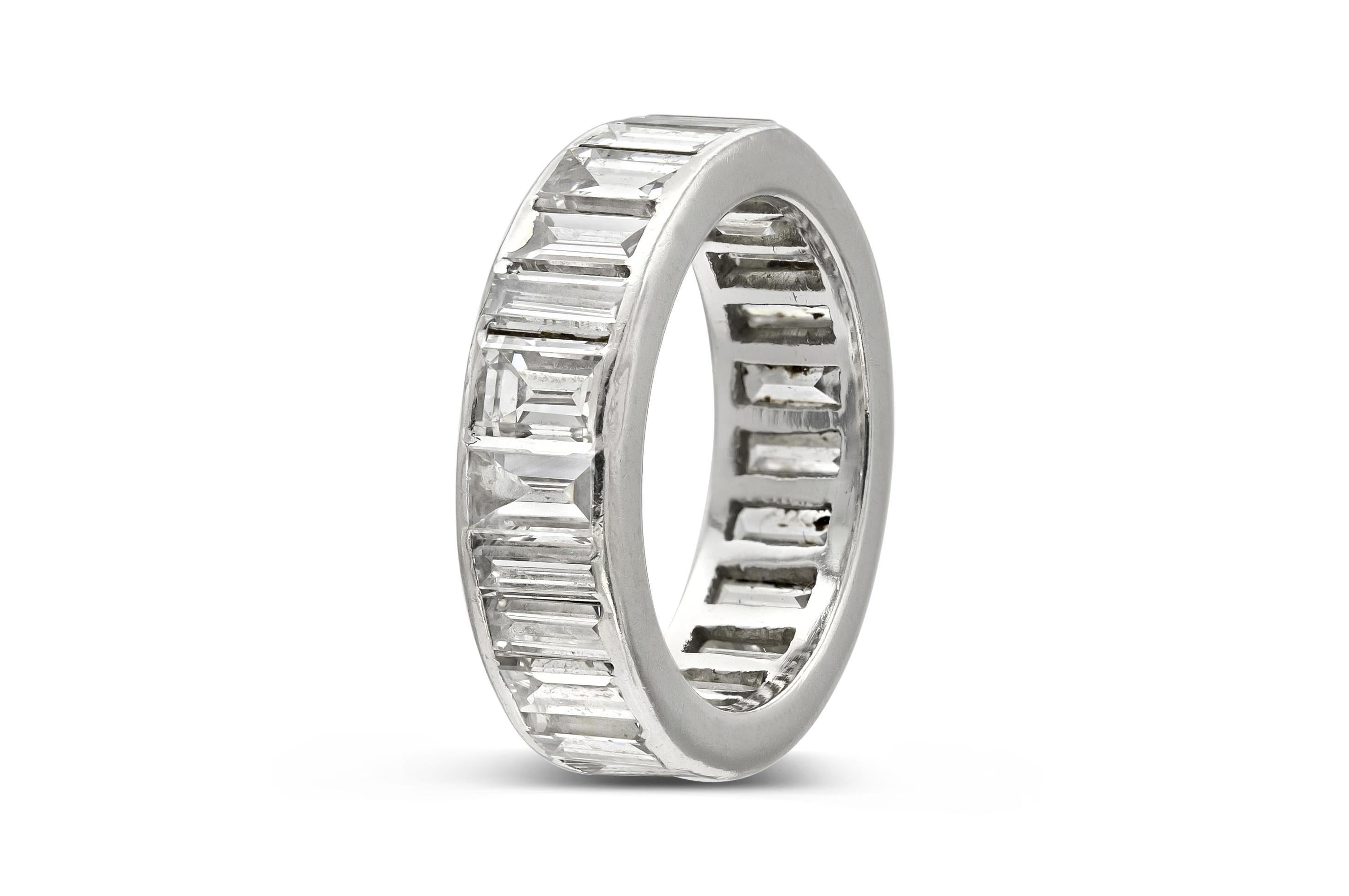 Finely crafted in platinum with 22 channel set Baguette cut Diamonds weighing a total of approximately 3.50 carats.
Circa 1930s
5.5mm wide
Size 4