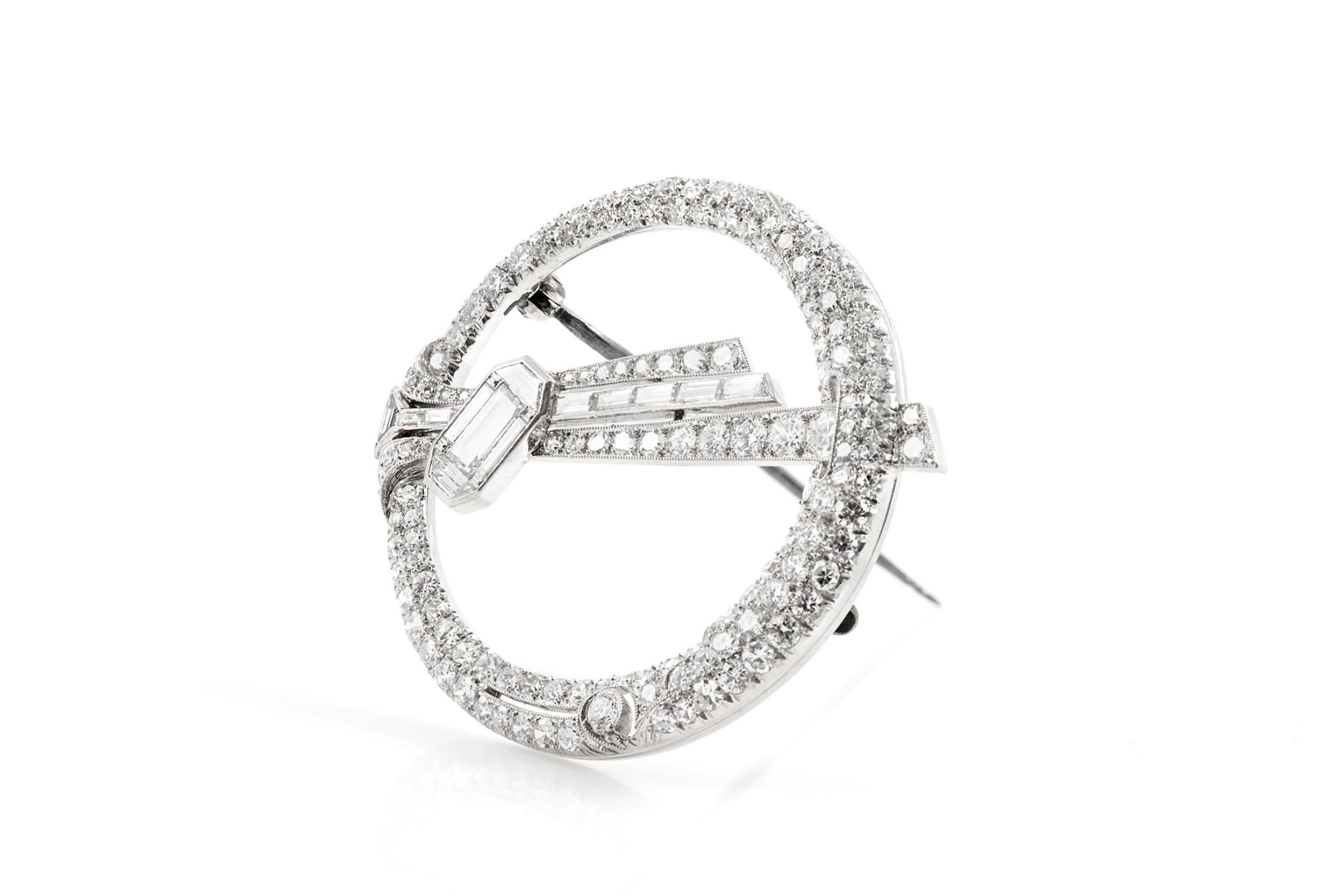 Finely crafted in platinum with Baguette and Single cut Diamonds weighing a total of approximately 5.00 carats.
Circa 1930s
1 7/16 inch diameter