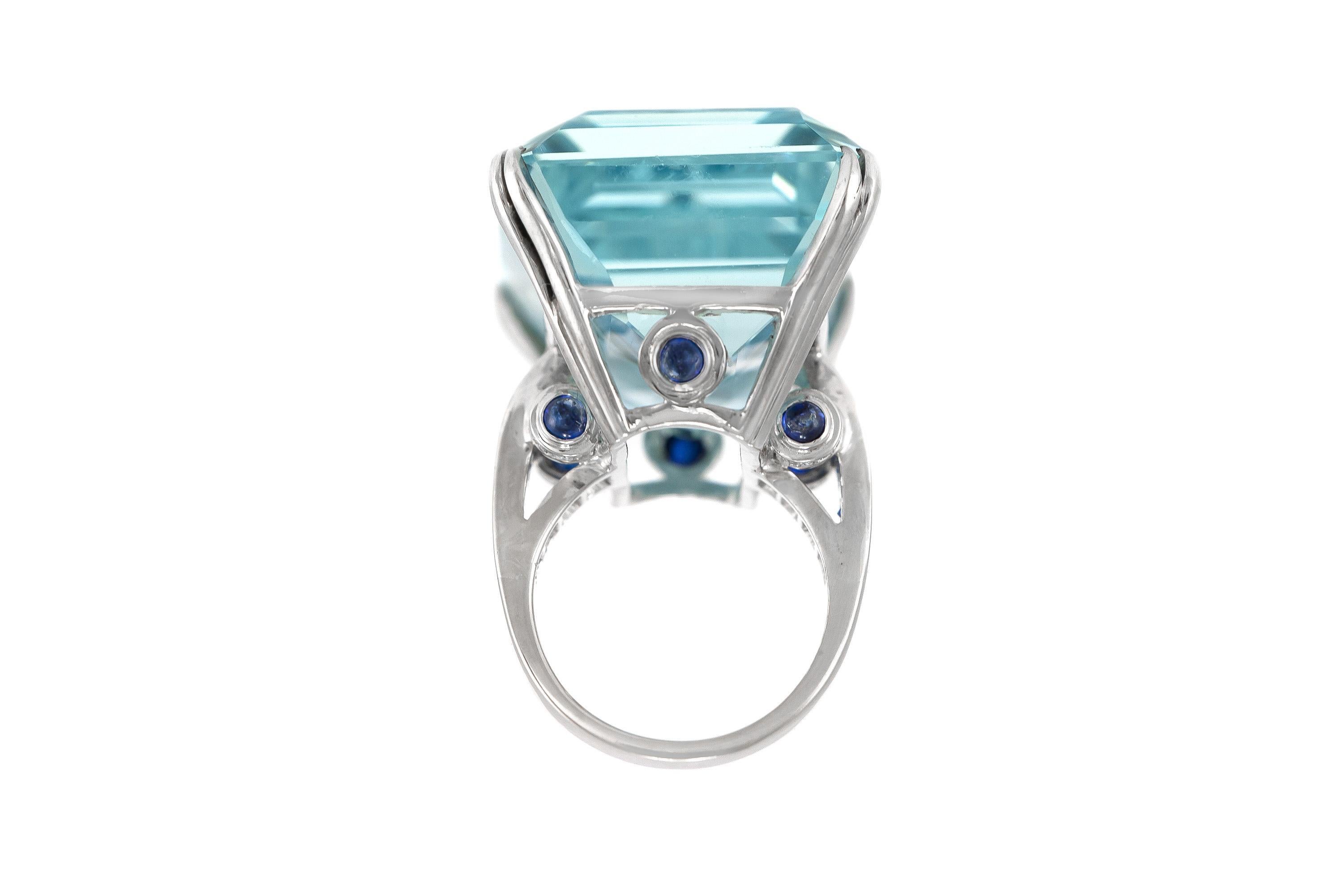 Emerald Cut Antique Art Deco 1930s 80.00 Carat Aquamarine Cocktail Ring with Sapphires For Sale
