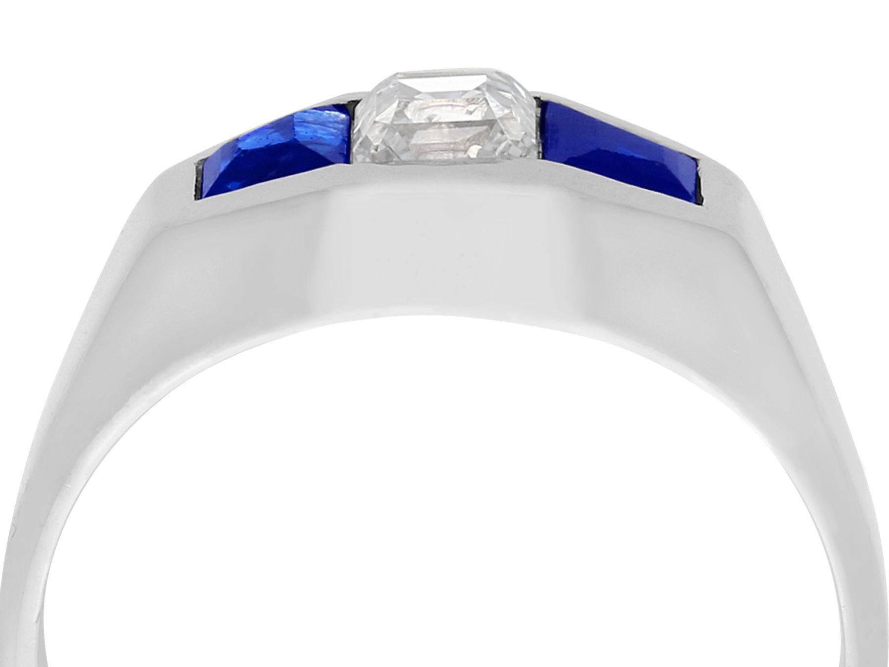 A fine and impressive antique French Art Deco style 0.30 carat diamond and 0.62 carat natural blue sapphire, 18 karat white gold three stone dress ring; part of our antique jewelry and estate jewelry collections

This fine and impressive antique