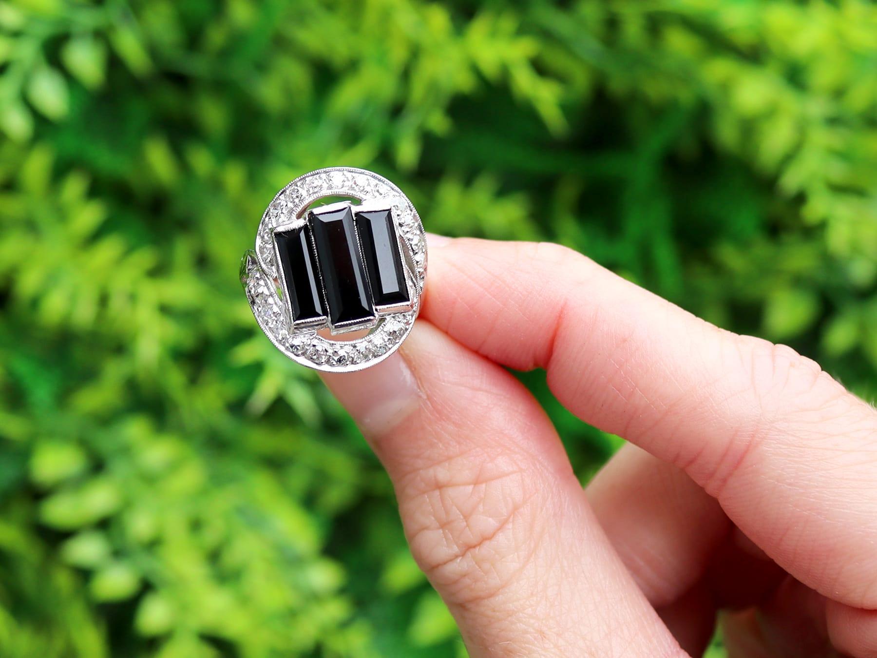 A stunning, fine and impressive, antique Art Deco 2.20 carat onyx and 0.50 carat diamond, platinum ring; part of our diverse collection of onyx jewelry.

This stunning, fine and impressive vintage onyx and diamond ring has been crafted in