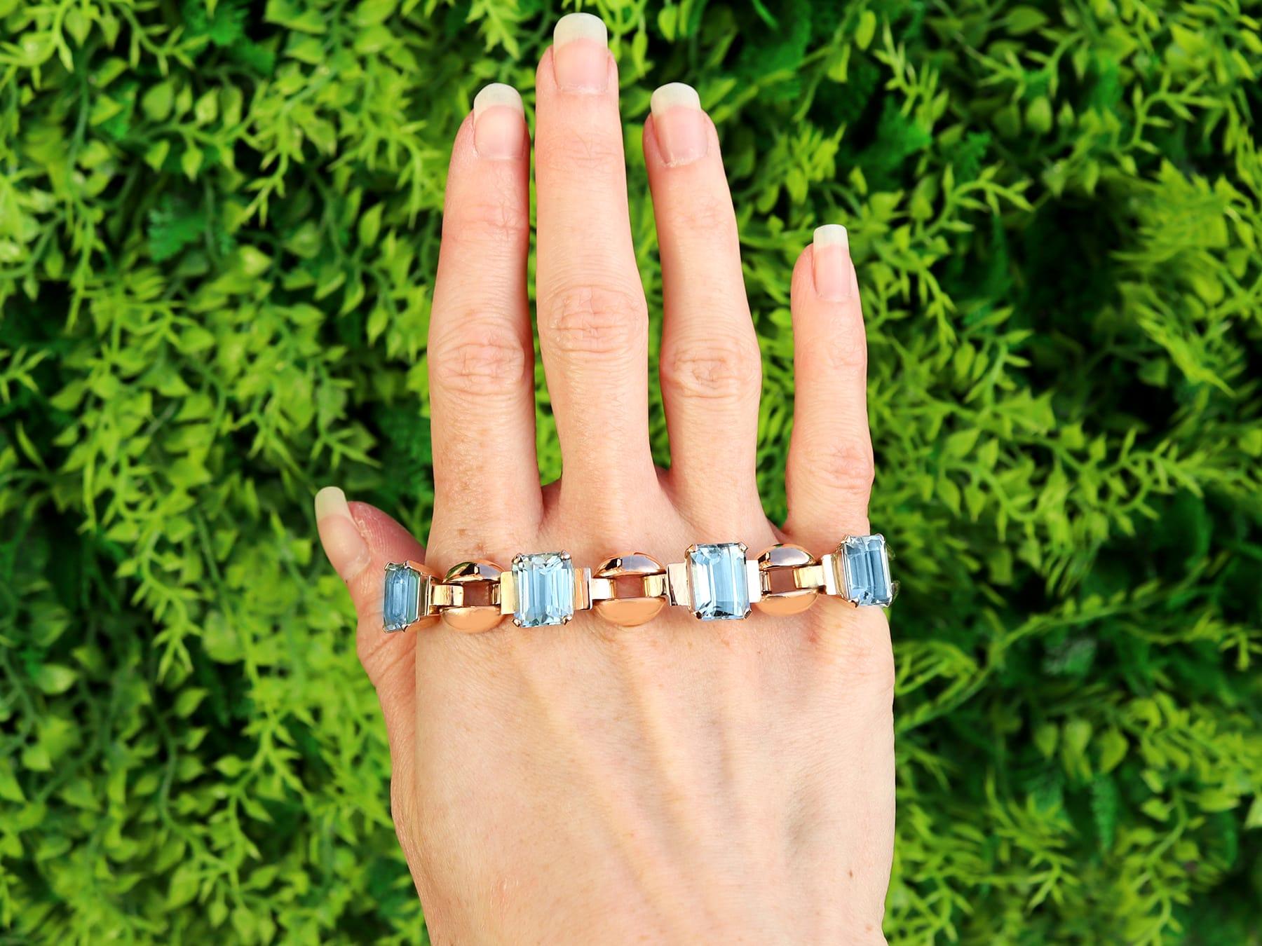 A stunning, fine and impressive antique 23.22 carat aquamarine and 15 karat rose gold Art Deco bracelet; part of our diverse collection of aquamarine jewelry.

This stunning, fine and impressive antique bracelet has been crafted in 15k rose