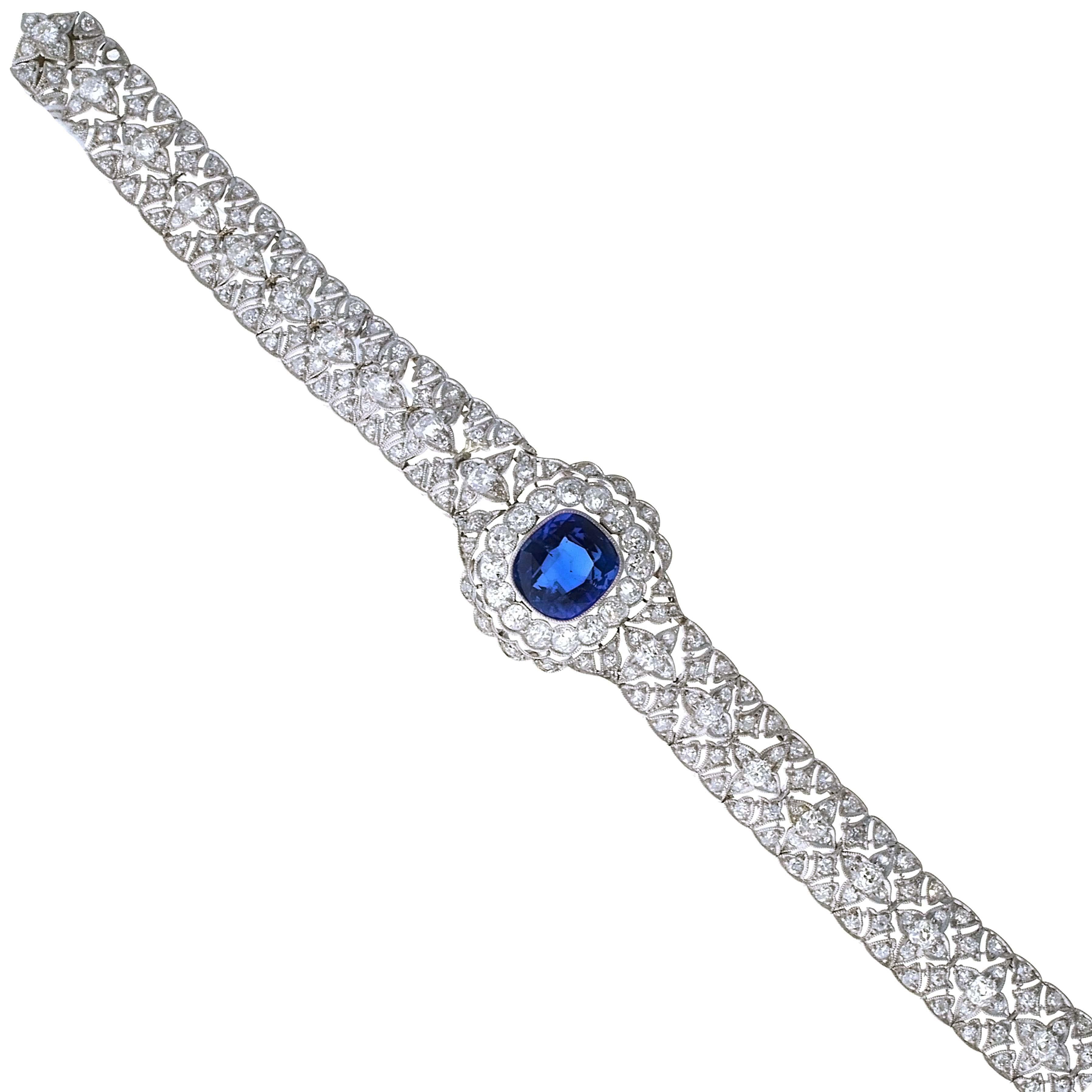 Antique 1920's Art Deco bracelet, crafted in platinum and 18 karat white gold showcasing a GCS-certified, unheated Burmeas cushion cut blue sapphire weighing 5.85 carats.
This antique bracelet has bright-white old European-cut diamonds set