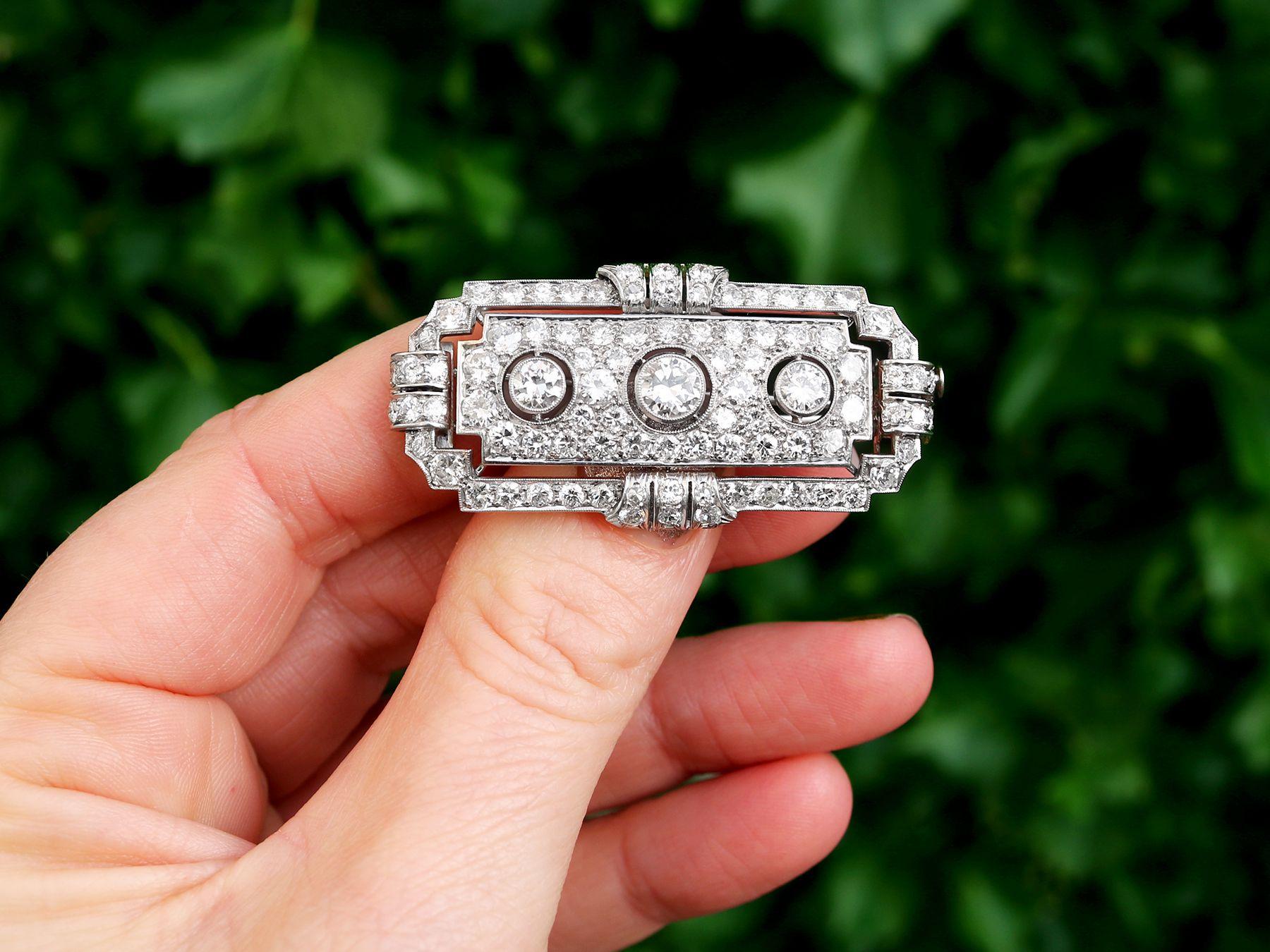 A stunning antique 1930s 6.82 carat diamond and platinum brooch; part of our diverse antique jewelry and estate jewelry collections.

This stunning, fine and impressive antique diamond brooch has been crafted in platinum.

The geometric Art Deco