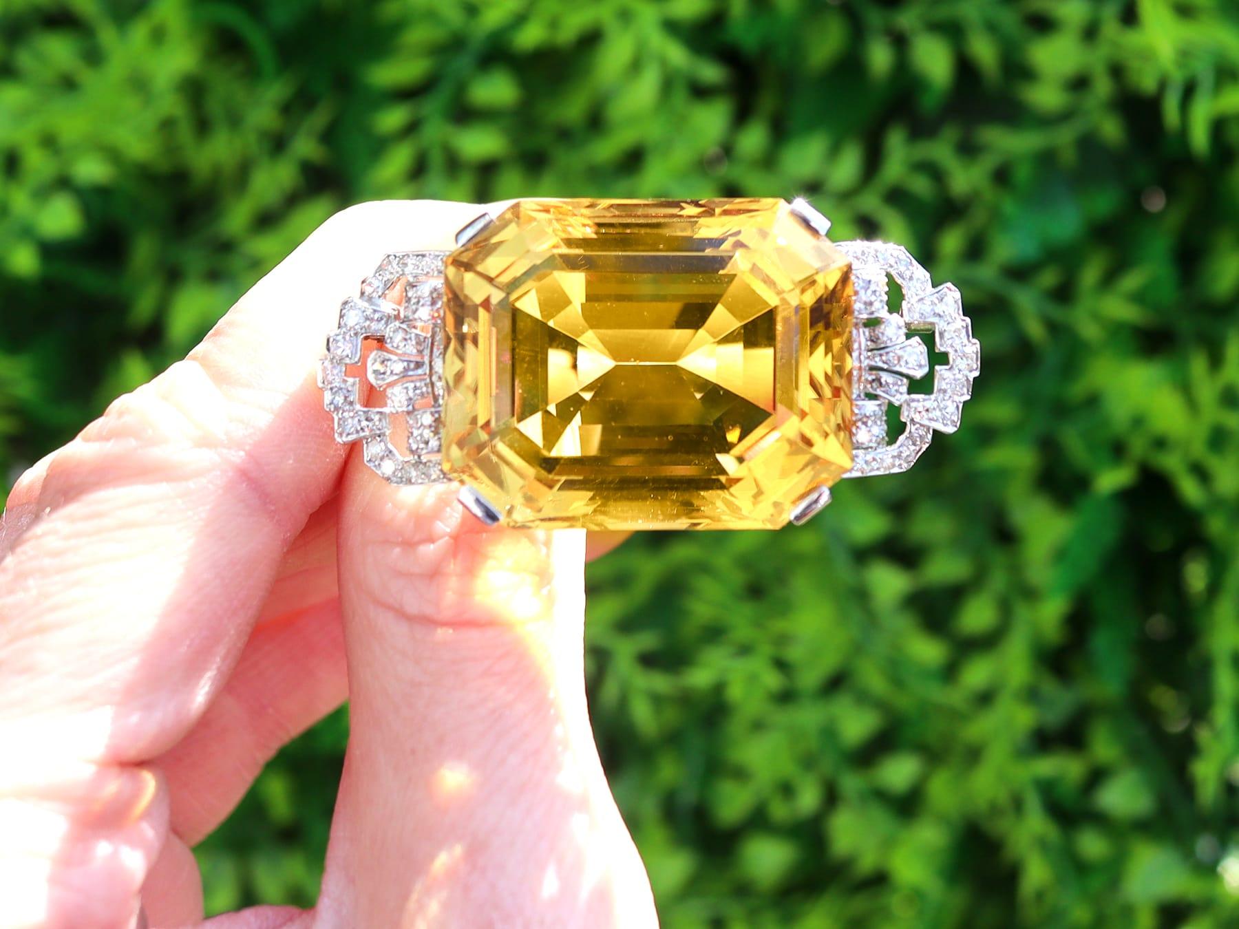 A stunning, fine and impressive antique 1930's 77.42 carat citrine and 1.16 carat diamond, platinum and white gold set Art Deco brooch; part of our diverse antique jewelry collections.

This stunning, fine and impressive Art Deco brooch has been