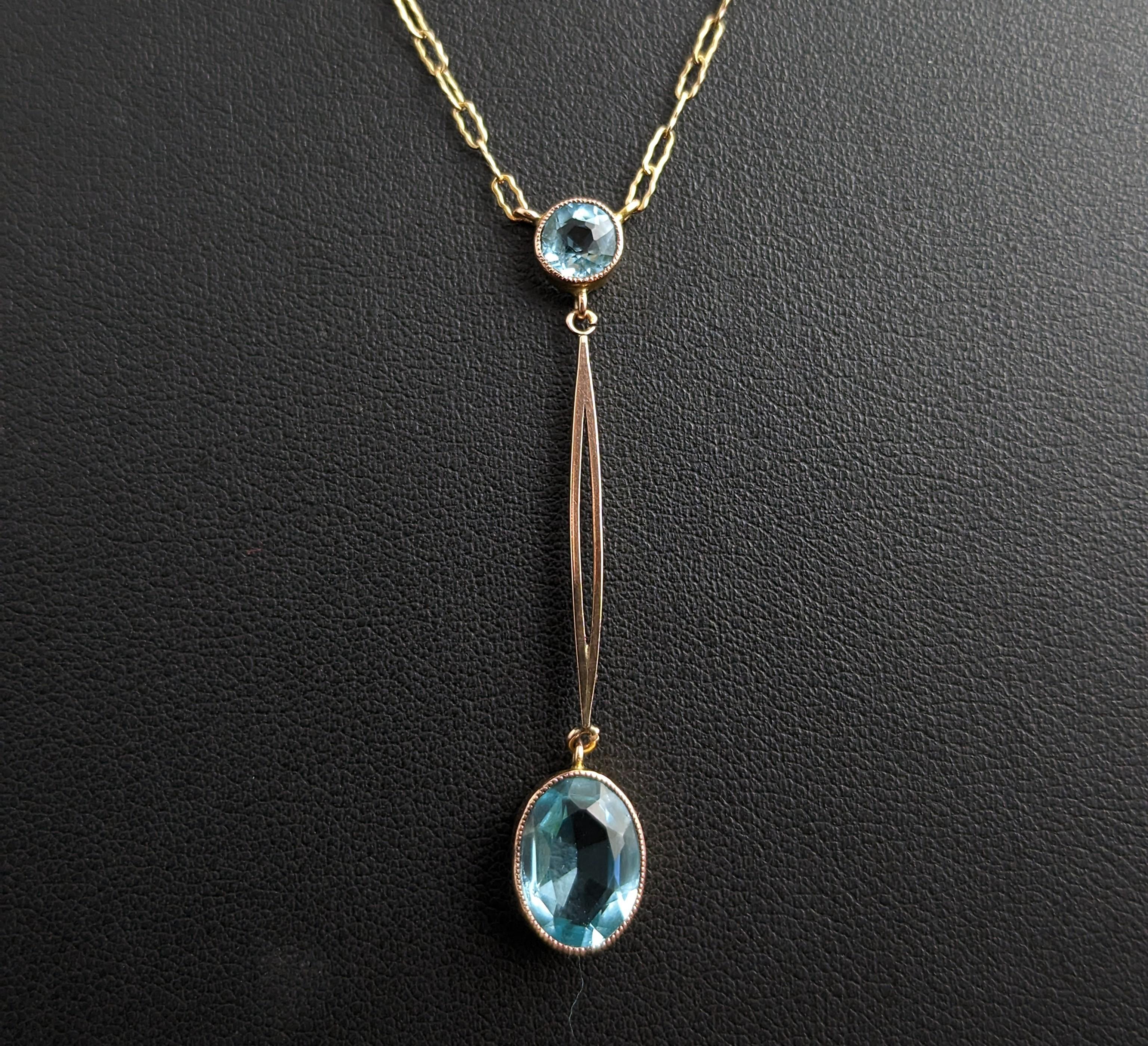 This beautiful Antique Art Deco 9kt Rose and yellow gold, blue paste drop pendant necklace is so feminine and pretty.

The pendant has a round cut vibrant blue paste to the top intercepted by a rose gold split bar drop, from here there is a