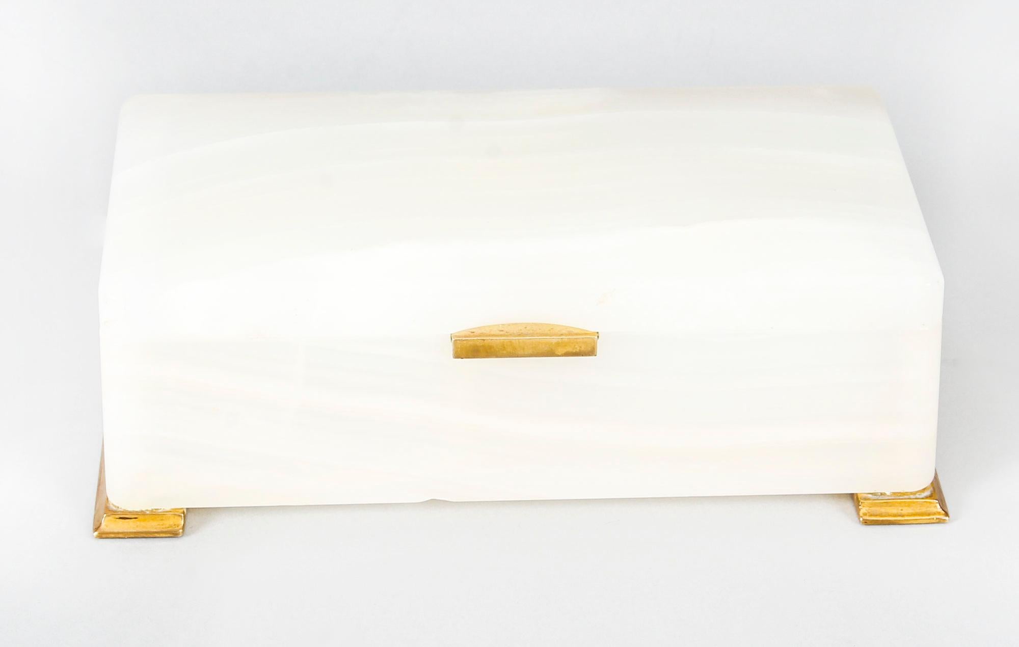 This is a fabulous and superb quality Art Deco white alabaster jewellery box by Betjemann & Sons, London, circa 1920 in date. 

This luxurious jewelry box is rectangular in shape and with sophisticated brass fittings to the lid and the base, it is