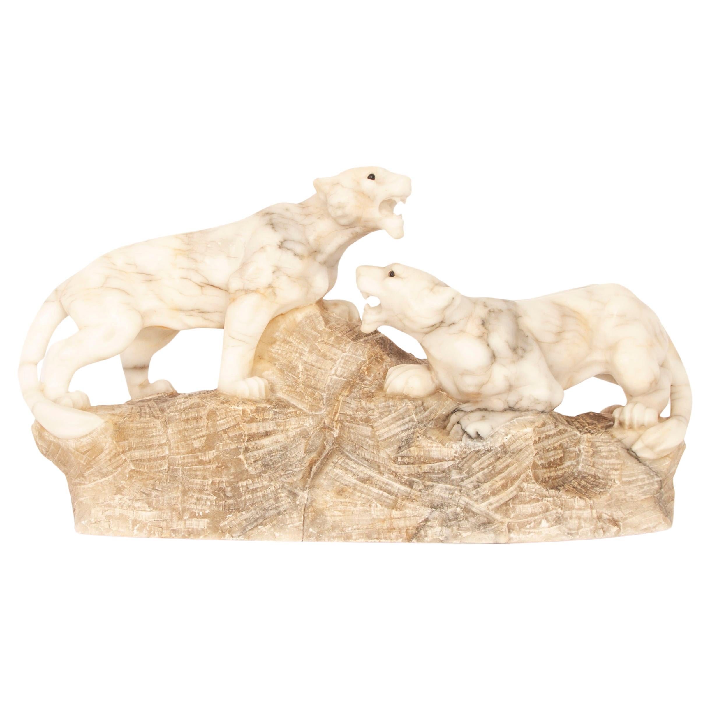 Sculpture Art déco ancienne en albâtre représentant une paire de lions 20ème siècle