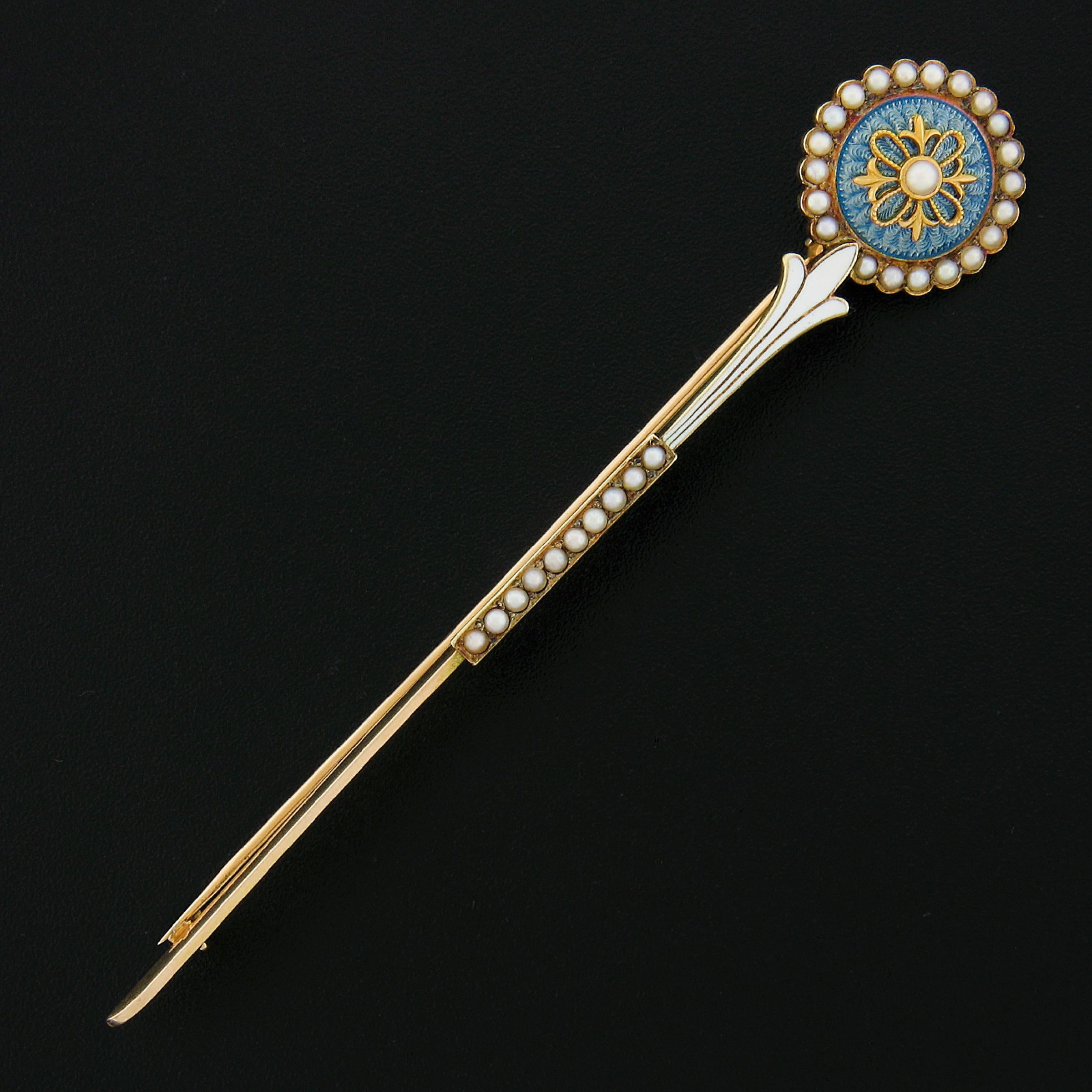 Here we have an exceptional art deco period brooch that was designed by Allsopp-Bliss Co. and crafted from solid 14k yellow gold. It features a beautiful flower design set with lovely seed pearls throughout and further adorned with white and blue