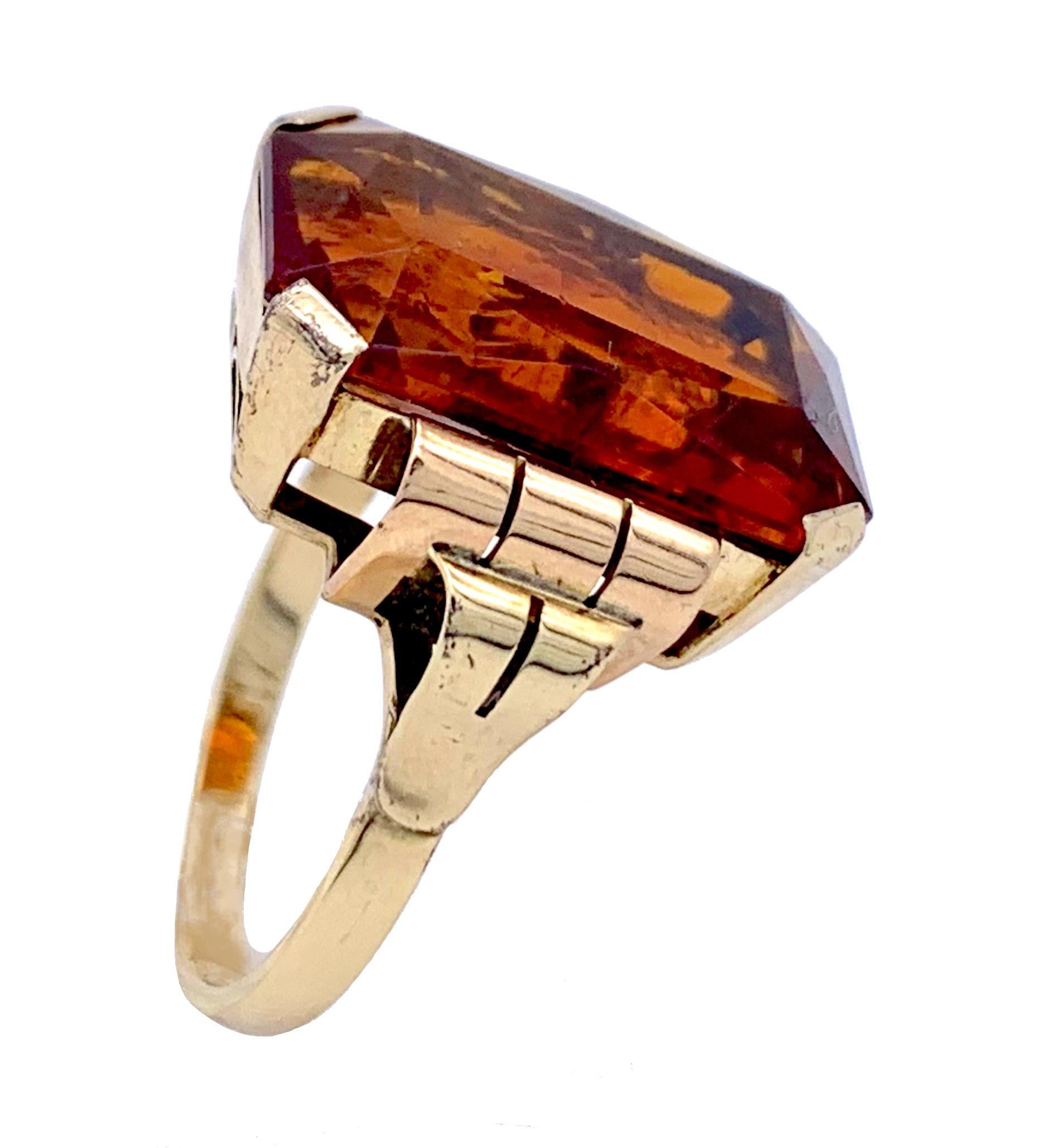 The octagonal cut amber of beautiful whisky colour is mounted in a shank made out of 14kt gold. 