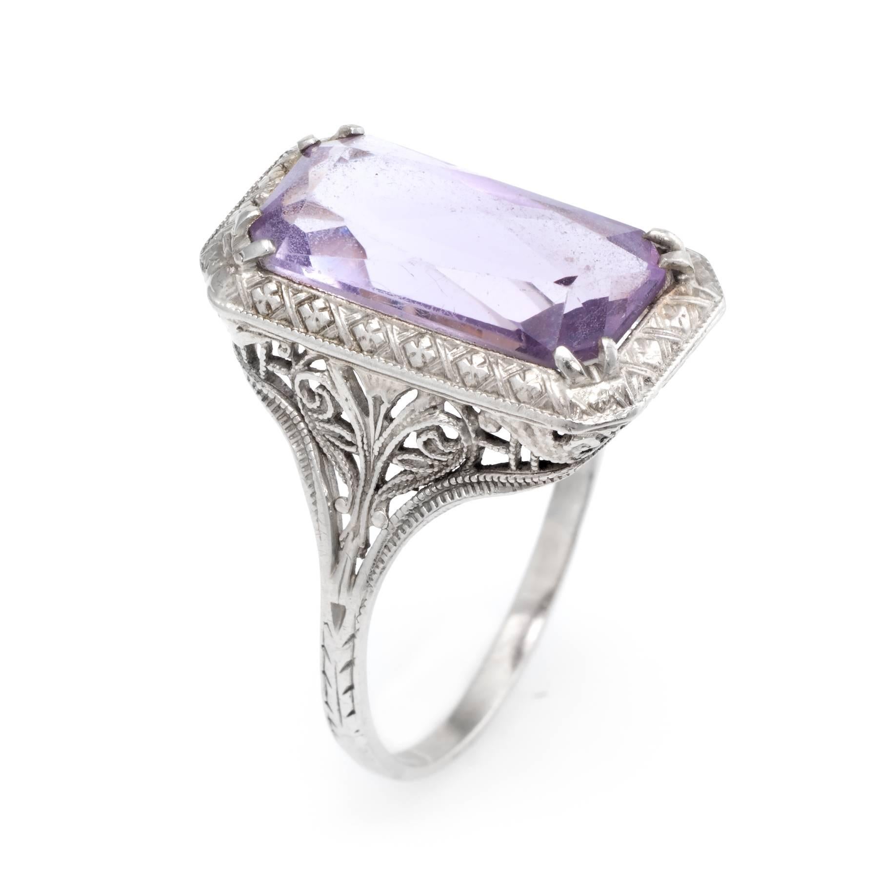 Elegant Art Deco era ring (circa 1920s to 1930s), crafted in 14 karat white gold. 

Faceted rectangular cut amethyst measures 16mm x 8mm (estimated at 5.50 carats). Few light surface abrasions to the amethyst (visible under a 10x loupe). 

Lacy