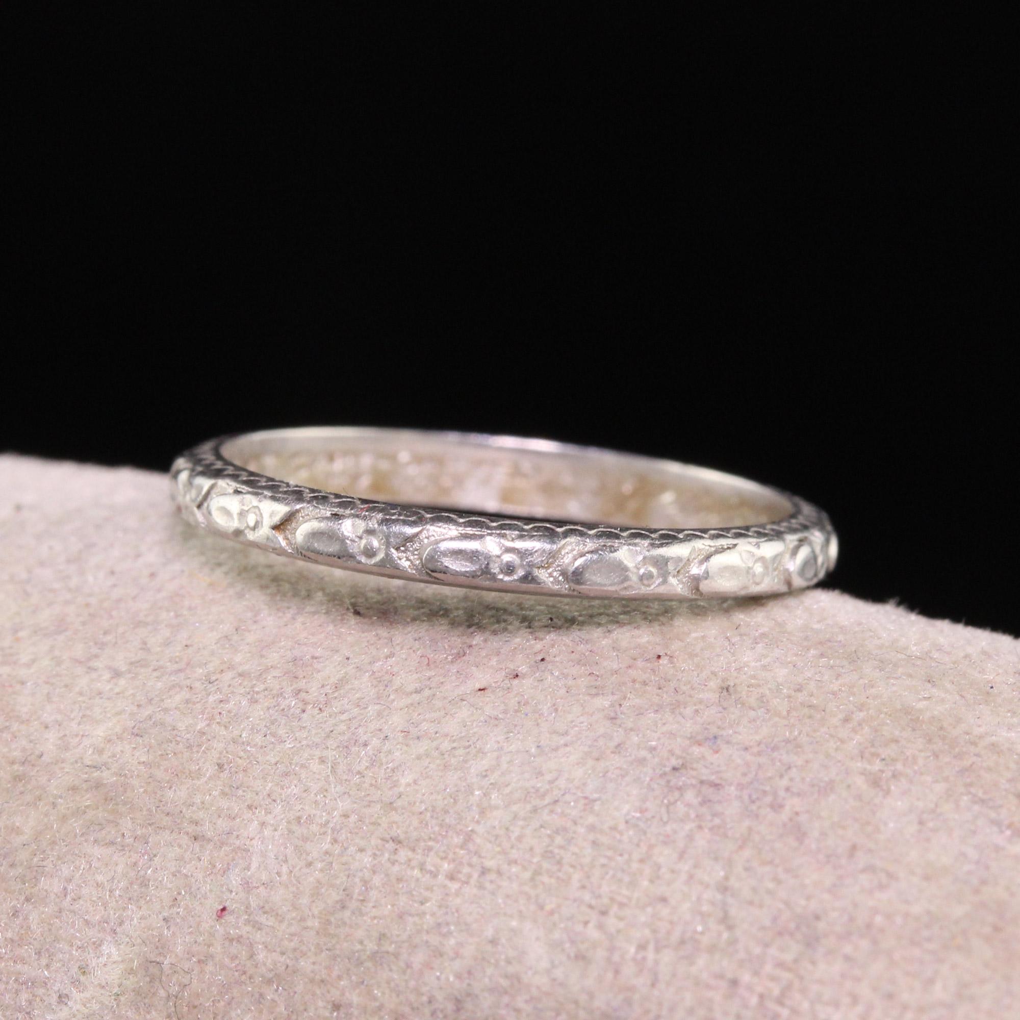 Beautiful Antique Art Deco Art Carved Wood Co Platinum Engraved Wedding Band. This gorgeous wedding band is crafted in platinum. The ring is nicely engraved with a beautiful pattern on the outside and has 