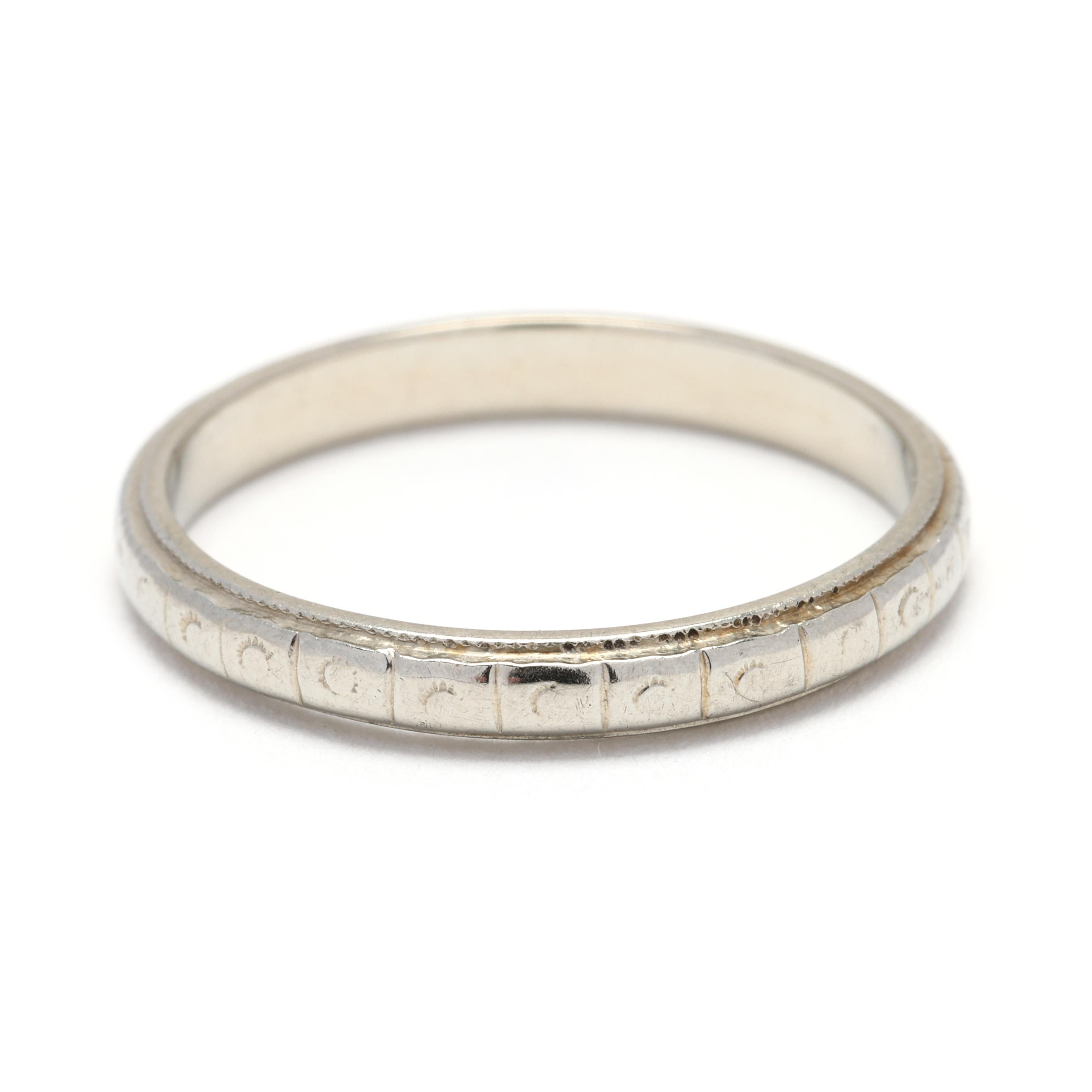 Celebrate the elegance of the Art Deco era with this antique band ring, crafted in luxurious 18k white gold. This size 6.5 ring features intricate engravings that capture the geometric beauty and sophistication of vintage Art Deco jewelry. Perfect