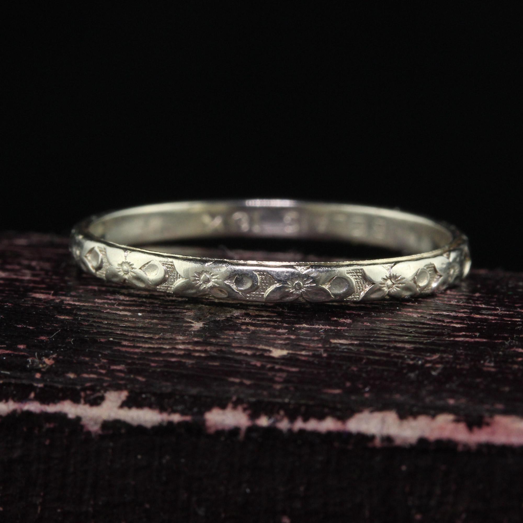 Beautiful Antique Art Deco Belais 18K White Gold Blossom Engraved Wedding Band - Size 8 1/4. This beautiful wedding band is crafted in 18k white gold. The ring has blossom engravings going around the entire ring. The ring sits low on the finger and