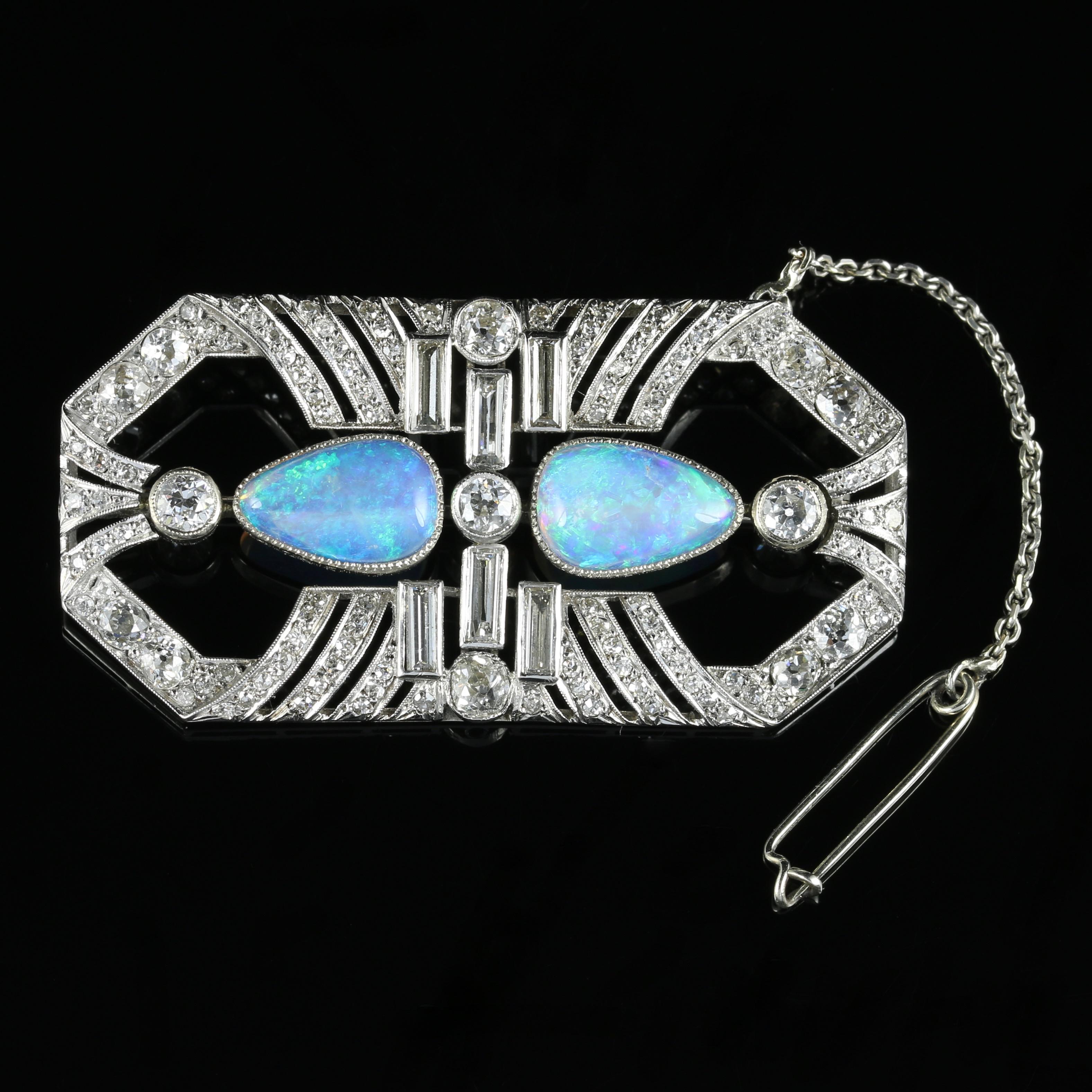 For more details please click continue reading down below...

This is a spectacular example of a genuine Art Deco Diamond and natural Opal brooch, all set in 18ct White Gold.

Each natural Opal is approximately 3ct in size and are a tapered pear