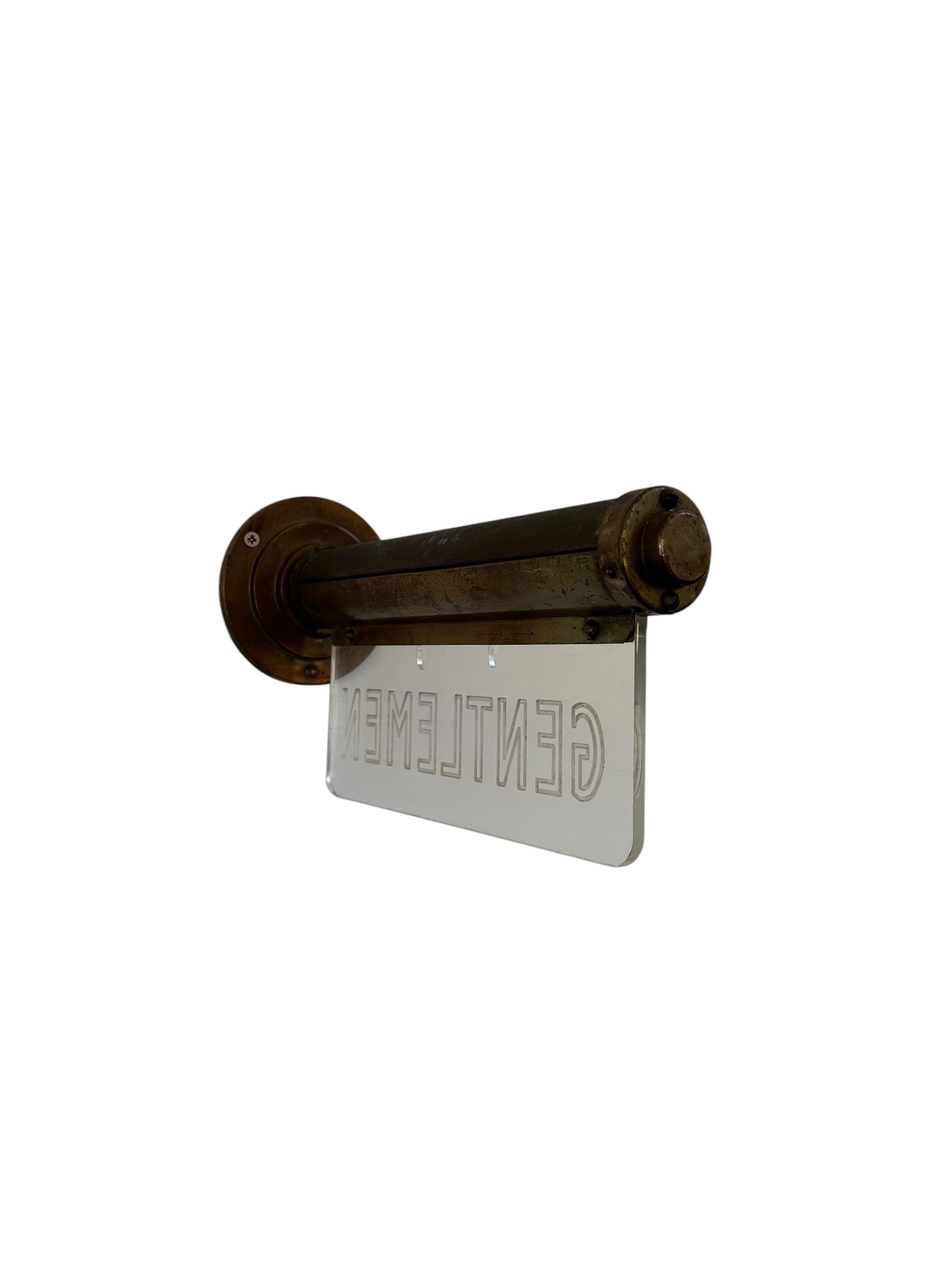- A fabulous Art Deco illuminated Gentlemen sign from renowned manufacturers 'Flambosign', England circa 1930.
- The worn brass casing marked 'Flambosign' houses an etched lucite perspex sign which glows beautifully when lit.
- Wonderful decorative