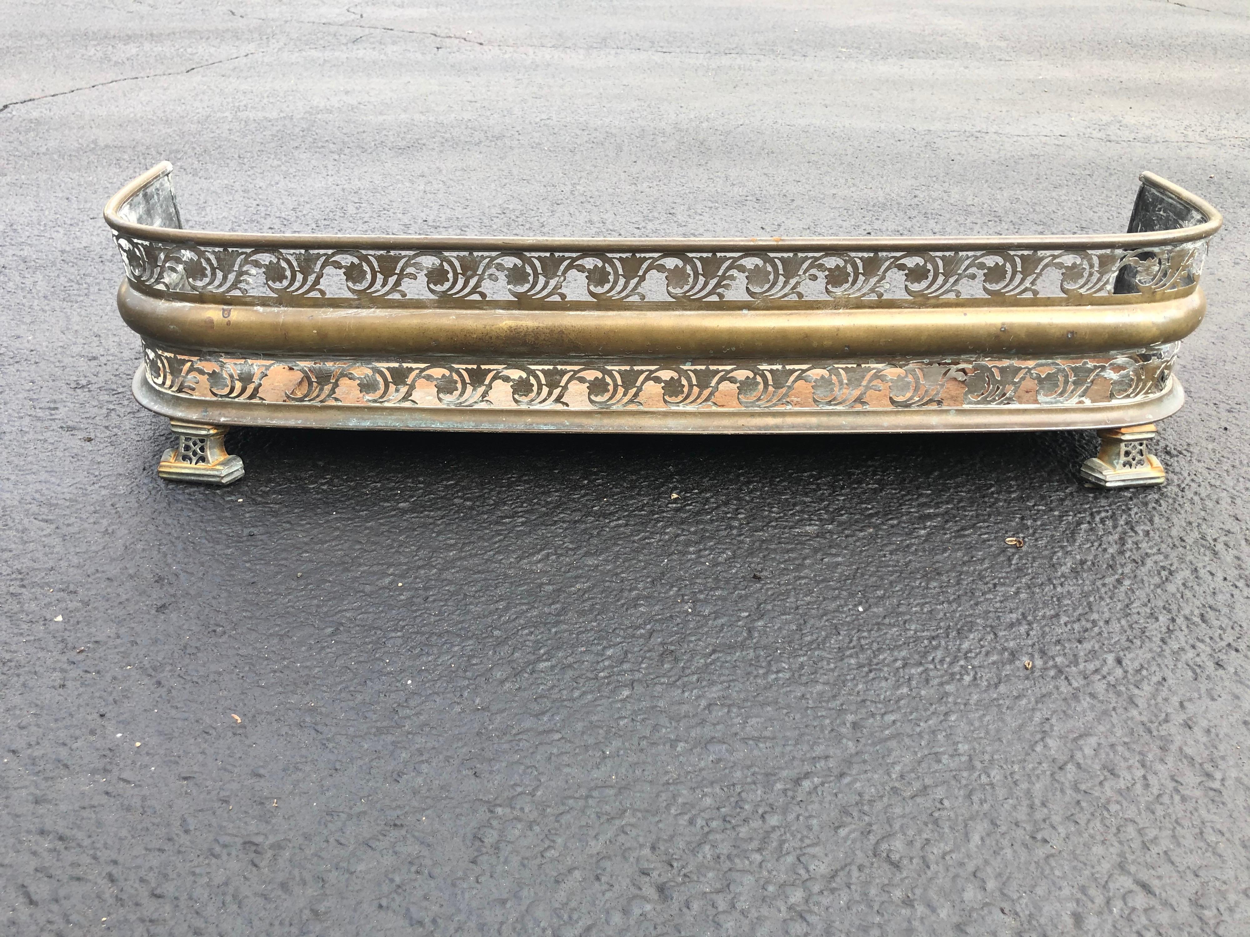 Antique Art Deco brass pierced fireplace fender. Weathered brass finish. Perfect for a deco fireplace. Can parcel ship for an economic rate. 