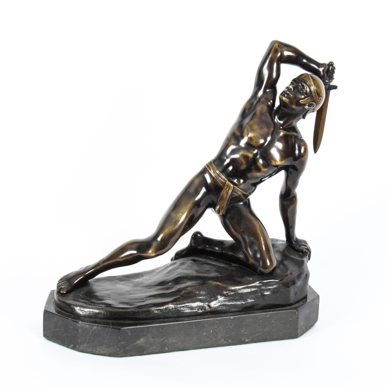 This is a gorgeous Art Deco bronze statue of a Fallen Roman Gladiator by the renowned artist Rudolf Kaesbach (1873-1955), circa 1920 in date. 

He is posed on one knee with his sword in his raised right hand, on a naturalistic mound base and