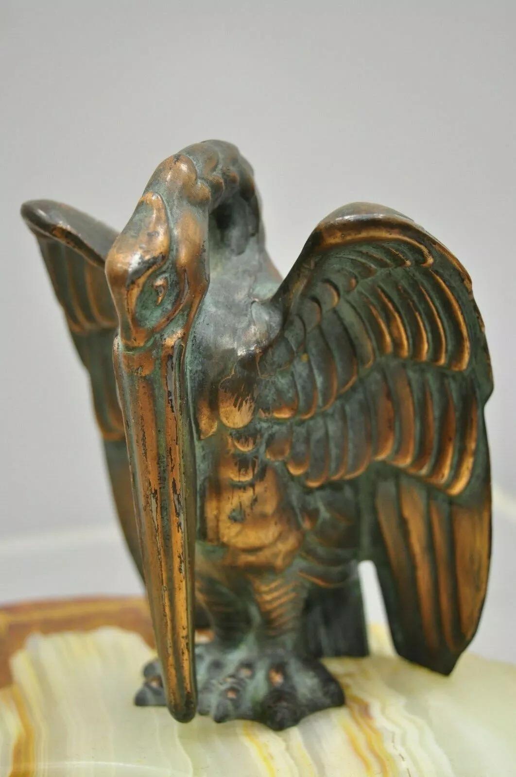 Antique Art Deco Onyx Marble Pelican Crane Bird Pen Holder Dish. Item features onyx/ marble dish base, copper clad metal pelican, single pen holder, very nice antique item. Circa Early 20th Century. Measurements: 6