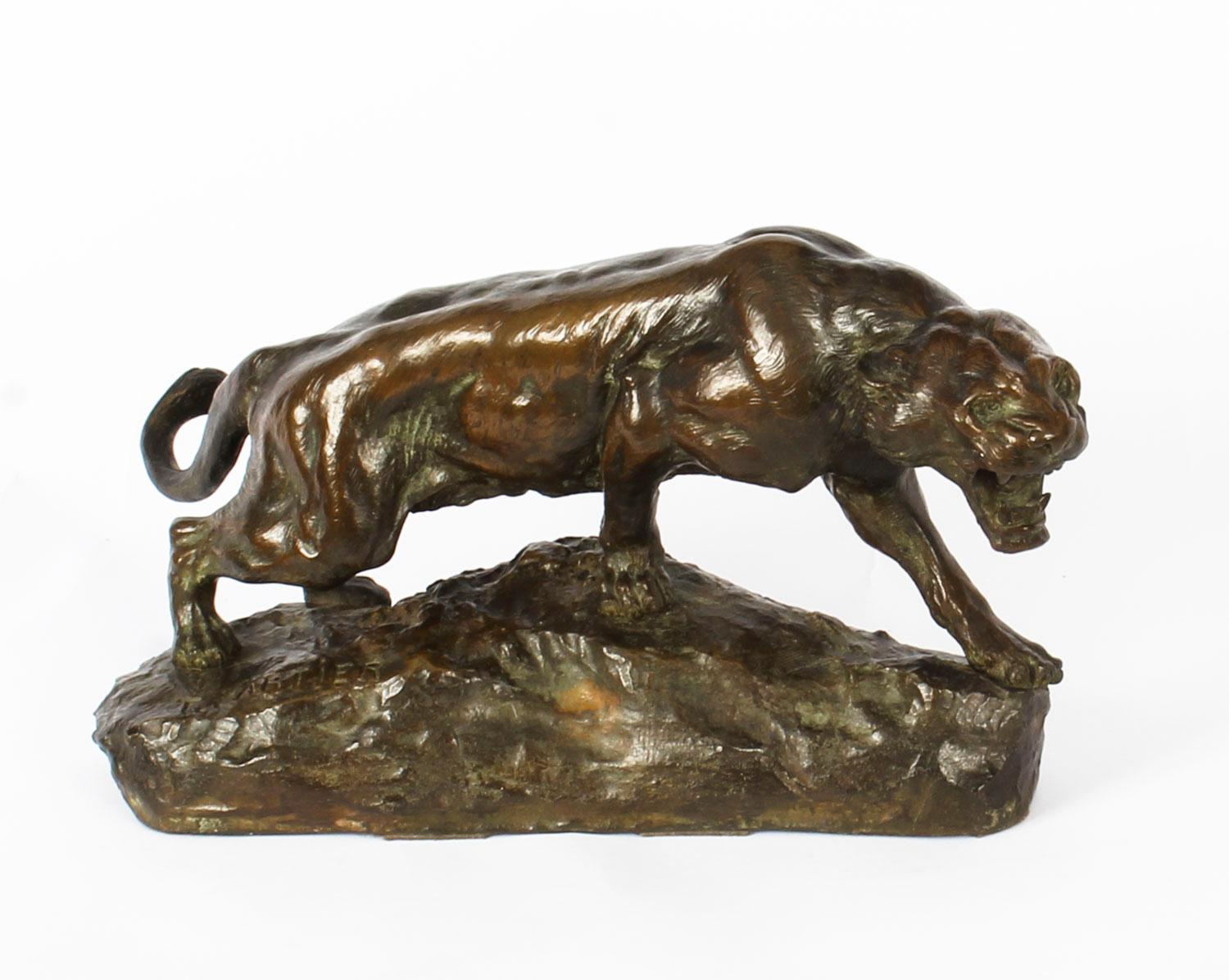 A beautiful large Art Deco patinated bronze study of a crouching tiger, signed Thomas François Cartier (1879-1943) circa 1920 in date.

The finely cast sculpture evokes a crouching tiger in motion with fantastic attention to detail. It has light