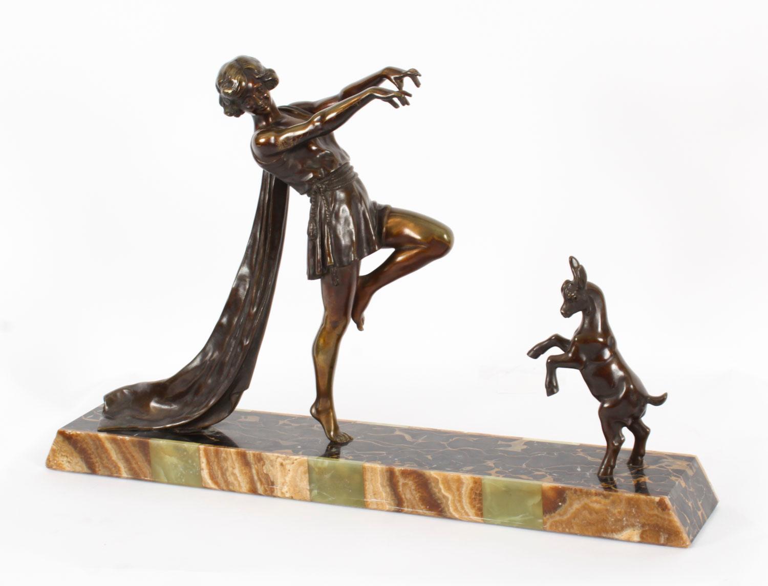 A large fine Art Deco patinated bronze and marble group of a toga dancer with a kid goat,  on a signed marble plinth,  by Emile Carlier,  (French 1849-1927),  Circa 1920 in date.

This powerful sculpture is modelled and cast as a  semi-clad female