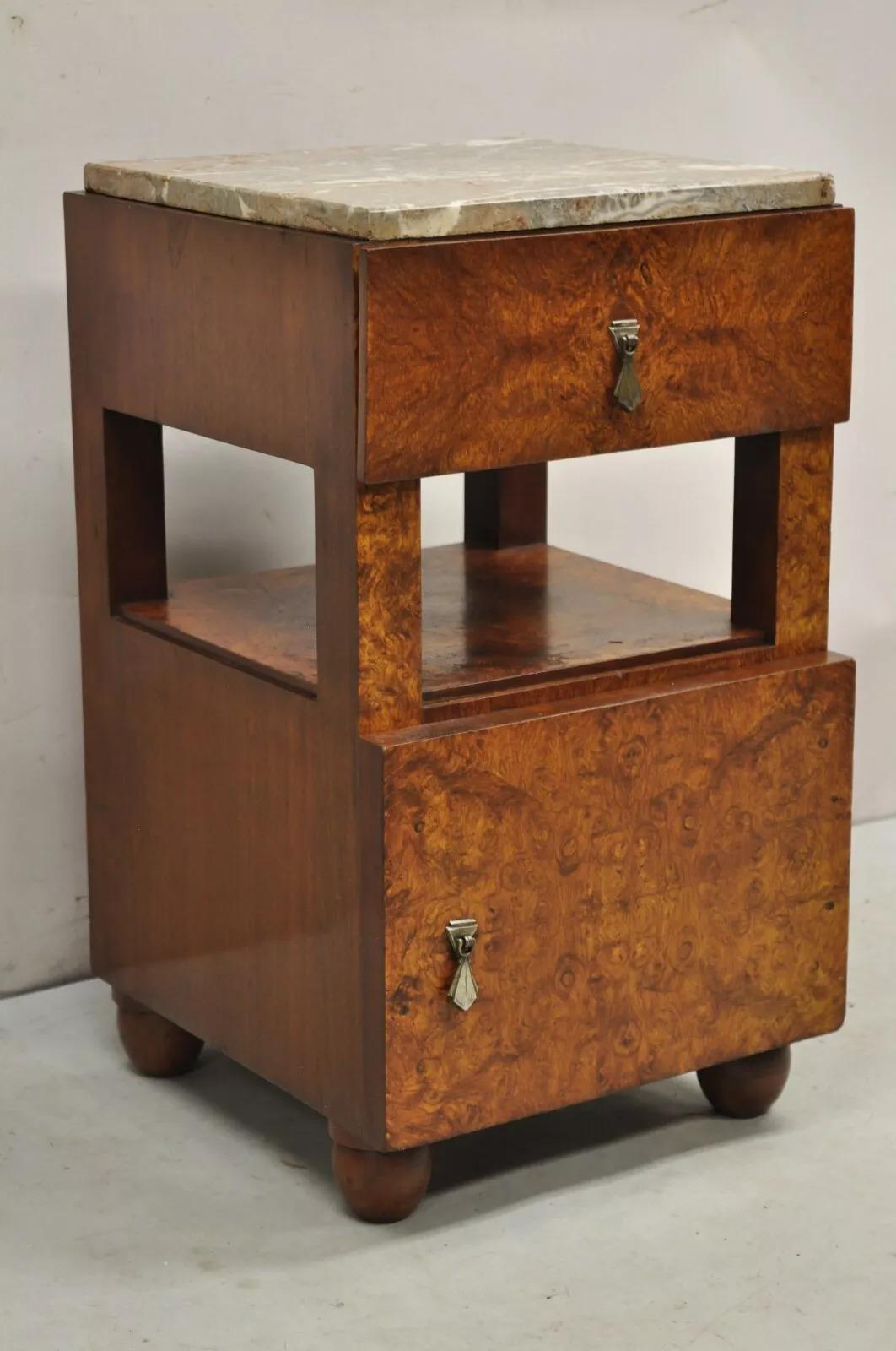 Antique Art Deco Burl Wood Marble Top Nightstand Washstand Bedside Table. Item features a porcelain lined interior, single drawer, beautiful wood grain, nice marble top. Circa Early 20th Century. Measurements: 25.5