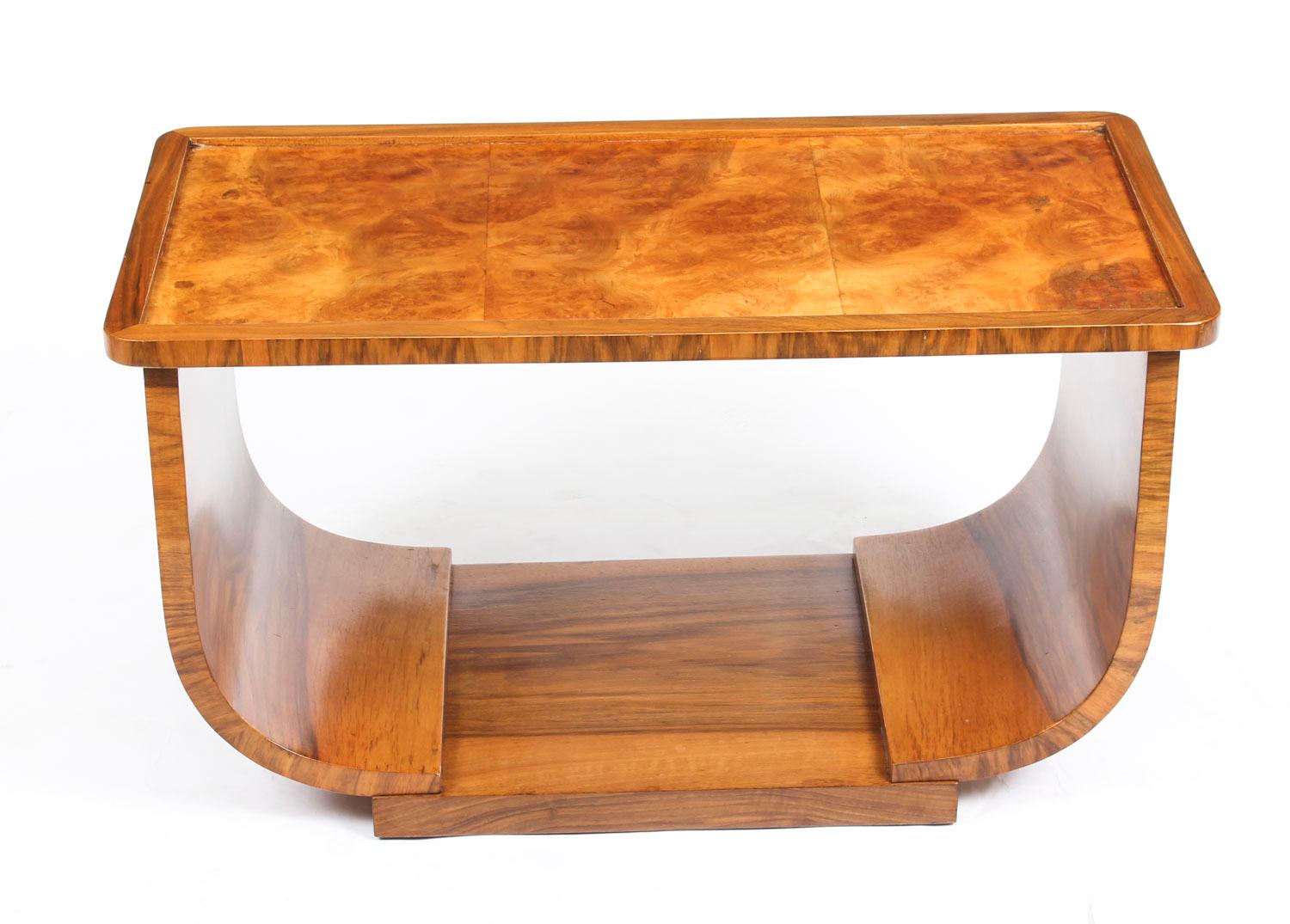 This is a superb antique Art Deco burr walnut coffee table, circa 1920 in date.

The table top is rectangular in shape and features wonderful burr walnut with superb walnut crossbanding. It is raised on a spectacular curved base typical of the