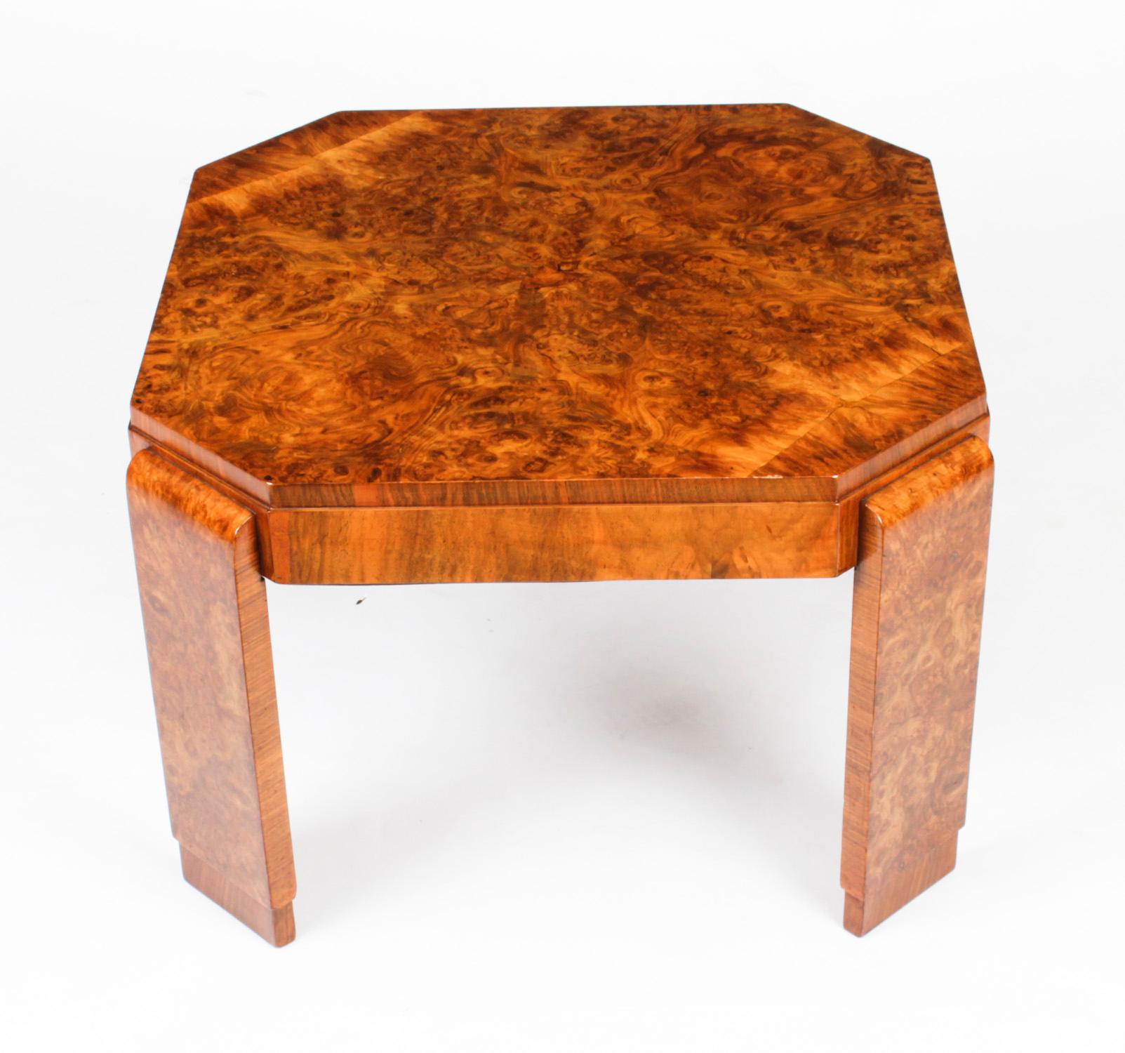 This is a superb antique Art Deco burr walnut coffee table, circa 1920 in date.

It has a wondeful burr walnut square shape table top with cut off corners and is raised on a plain strut supports s typical of the best items of the Art Deco