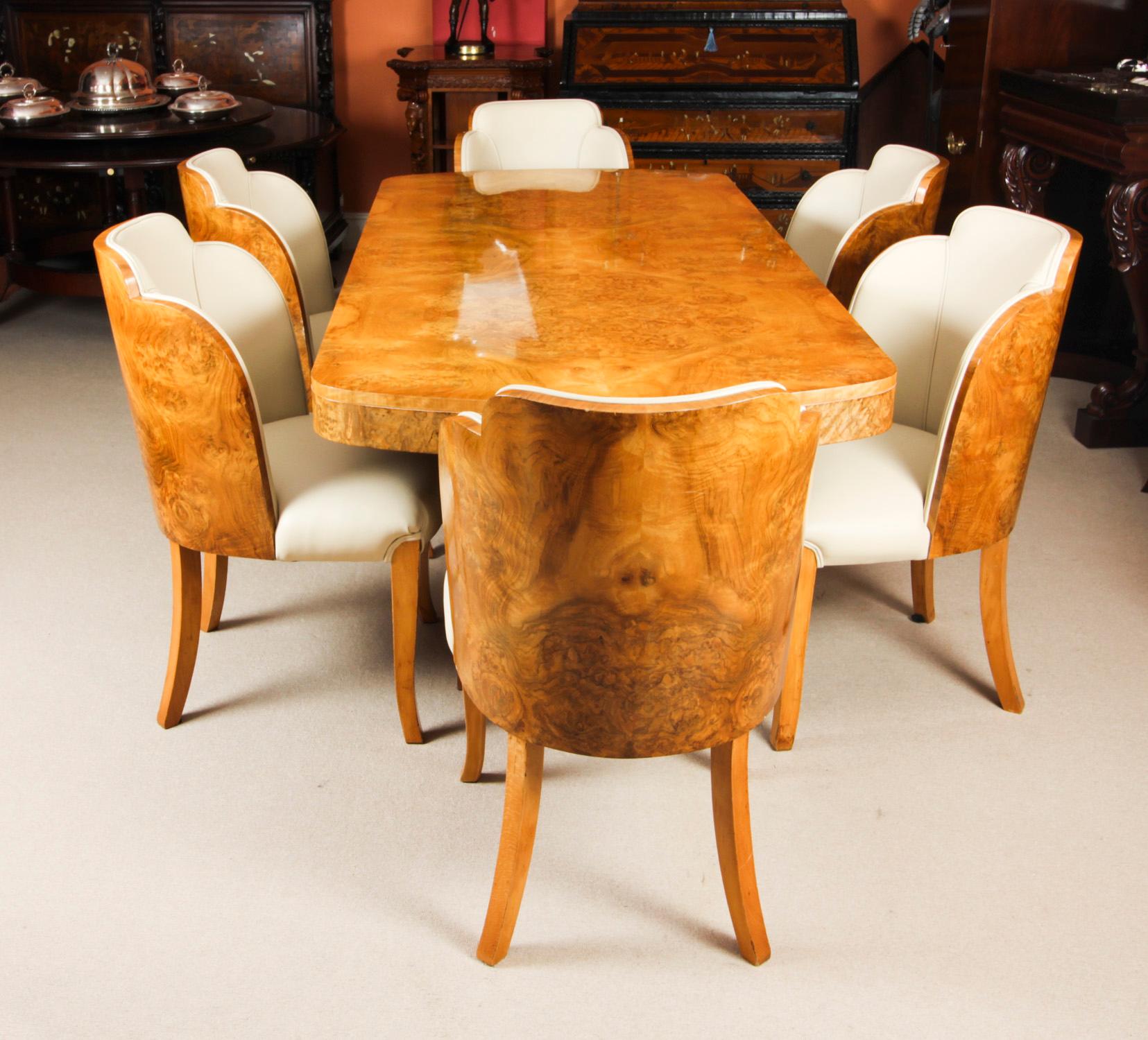 A truly stunning antique Art Deco burr walnut dining suite attributed to the world renowned cabinet makers, Harry & Lou Epstein, comprising a dining table and the original matching set of six cloud back dining chairs, circa 1920 in date.
 
The