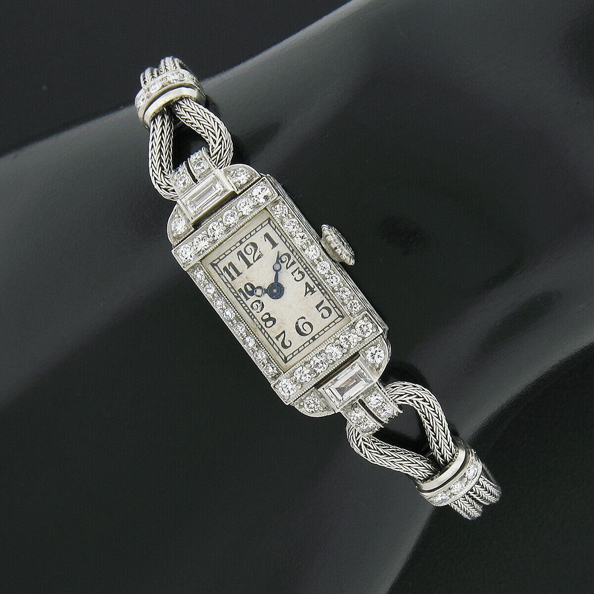 This fancy antique ladies' wrist watch was crafted during the art deco period. It features a mechanical, hand winding, Swiss movement made by C. H. Meylan and keeps excellent time. The platinum rectangular case and crown are adorned with the most