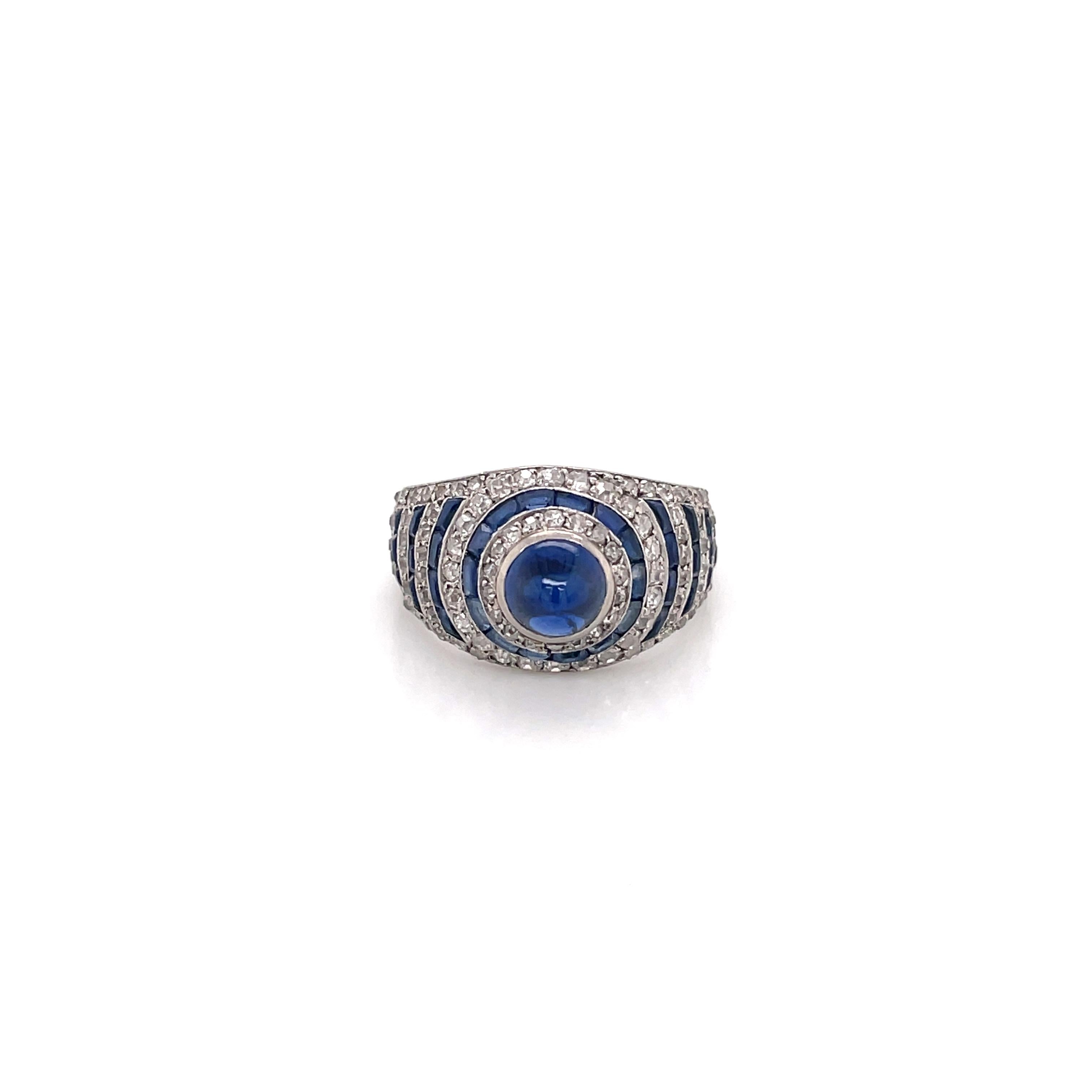 A classic Art Deco ring featuring a 1.15CT Cabochon Sapphire as the center stone, 40 Baguette cut sapphires, and 105 Old Mine Cut VS-SI Clarity Diamonds as the side stones. 

Inquiries for additional photos, videos, and requests to see this piece