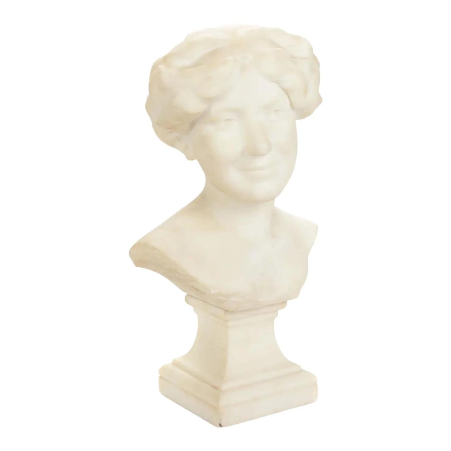 A stunning carved Carrara marble bust of a young woman displayed on a carved marble pedestal

Bust by Paul Philippe

France, Circa 1920s

Overall measures: 11.75