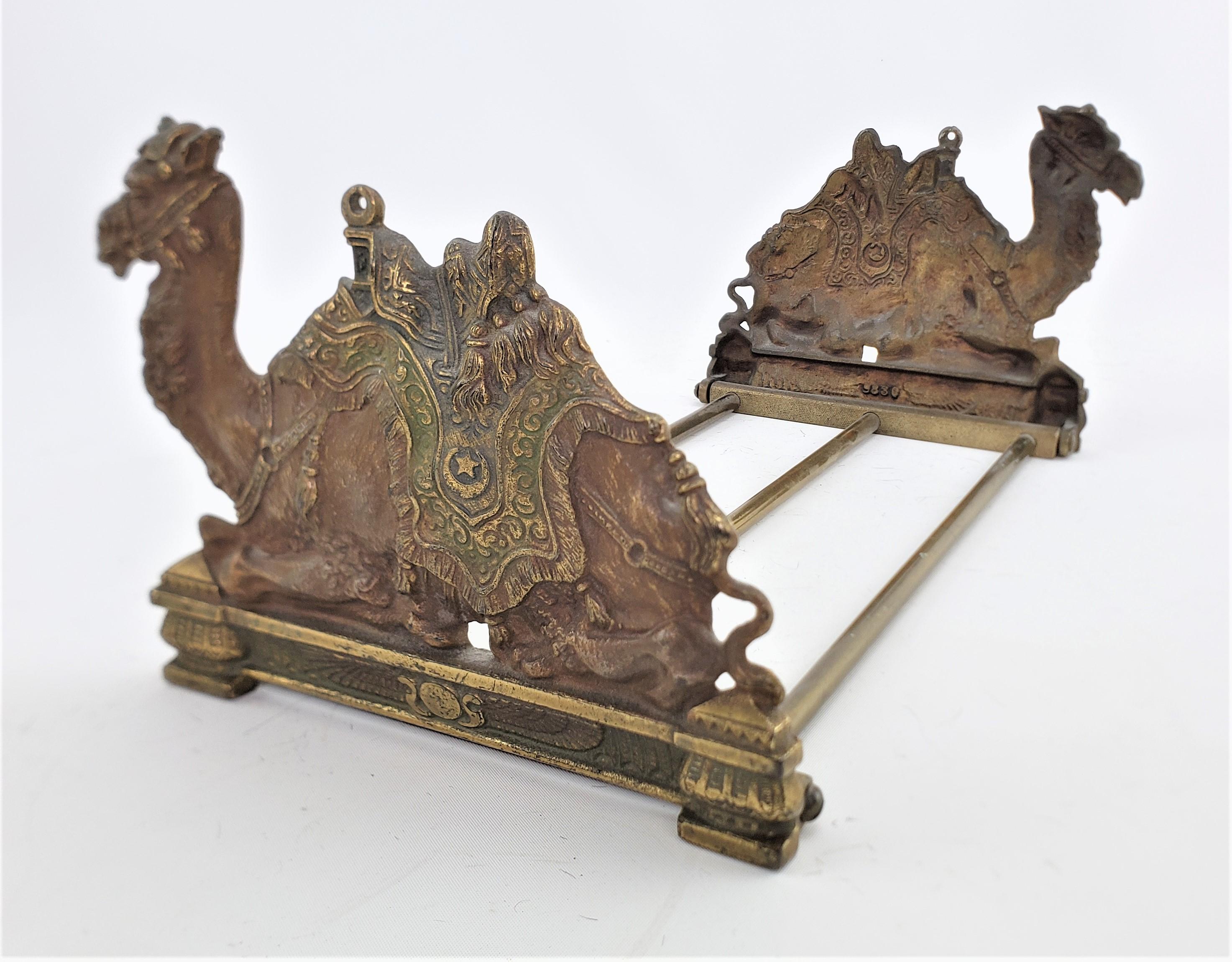 This very well executed cast and cold-painted bronze and brass book stand is unsigned, but presumed to have originated from Austria and dating to approximately 1920 and done in a period Art Deco style. The stand is quite heavy and very sturdy and