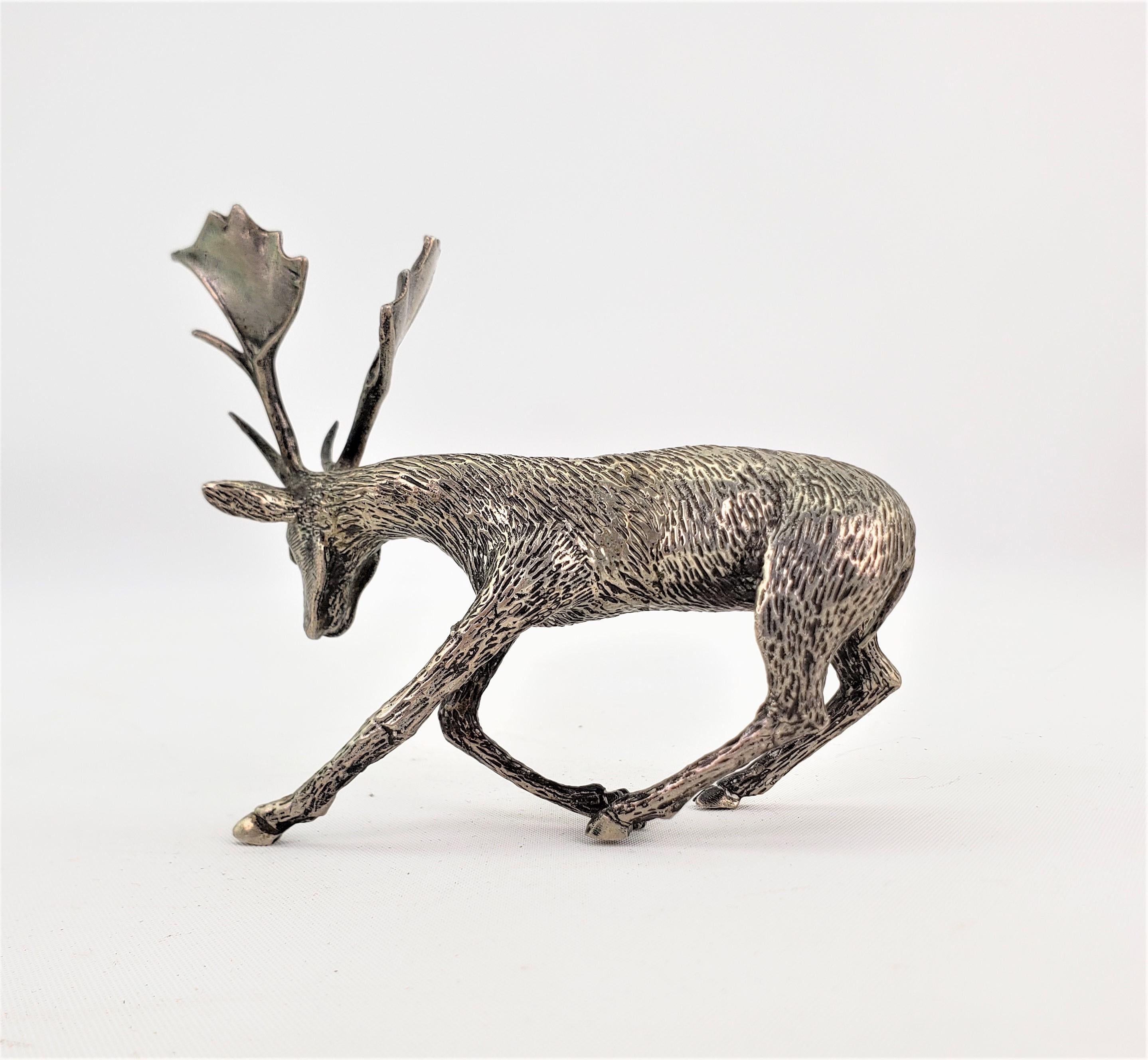 This cast Continental silver sculpture is signed by an unknown maker and presumed to have originated from Italy and dating to approximately 1920 and done in the period Art Deco style. The study depicts and standing male deer or elk with its head