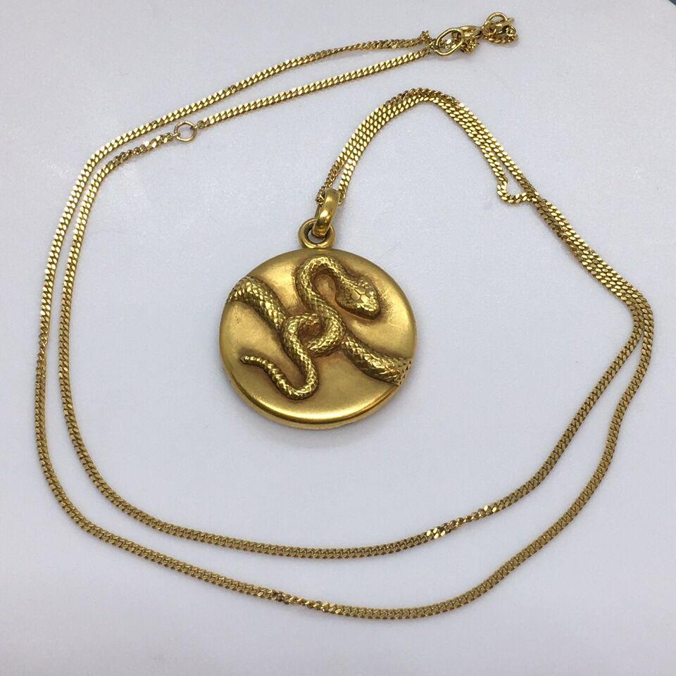 Antique Art Deco era 14k Gold Chase work marked 14K and maker’s emblem old Chain

22 inch chain with a loop at 20.5 inch
12.2 gram total weight 
1 inch diameter locket in superb condition
In good condition, no dents, no damage, shows never repaired,