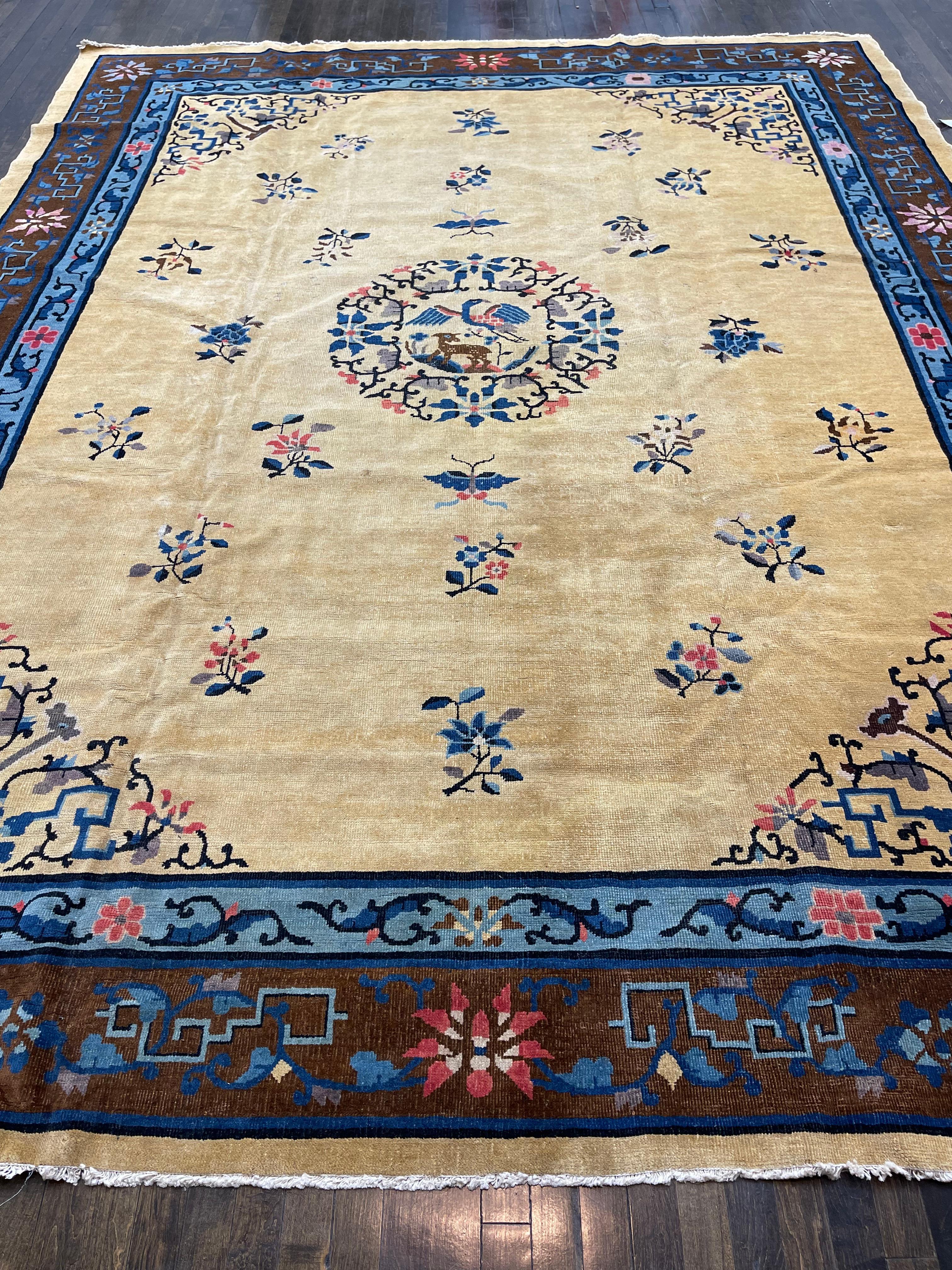 This antique carpet is hand knotted in China circa 1910. Known as mainland Chinese these carpets were made with high quality wool and all organic dyes, which makes them really age well and develop a nice patina.

Having a tan/brown field with