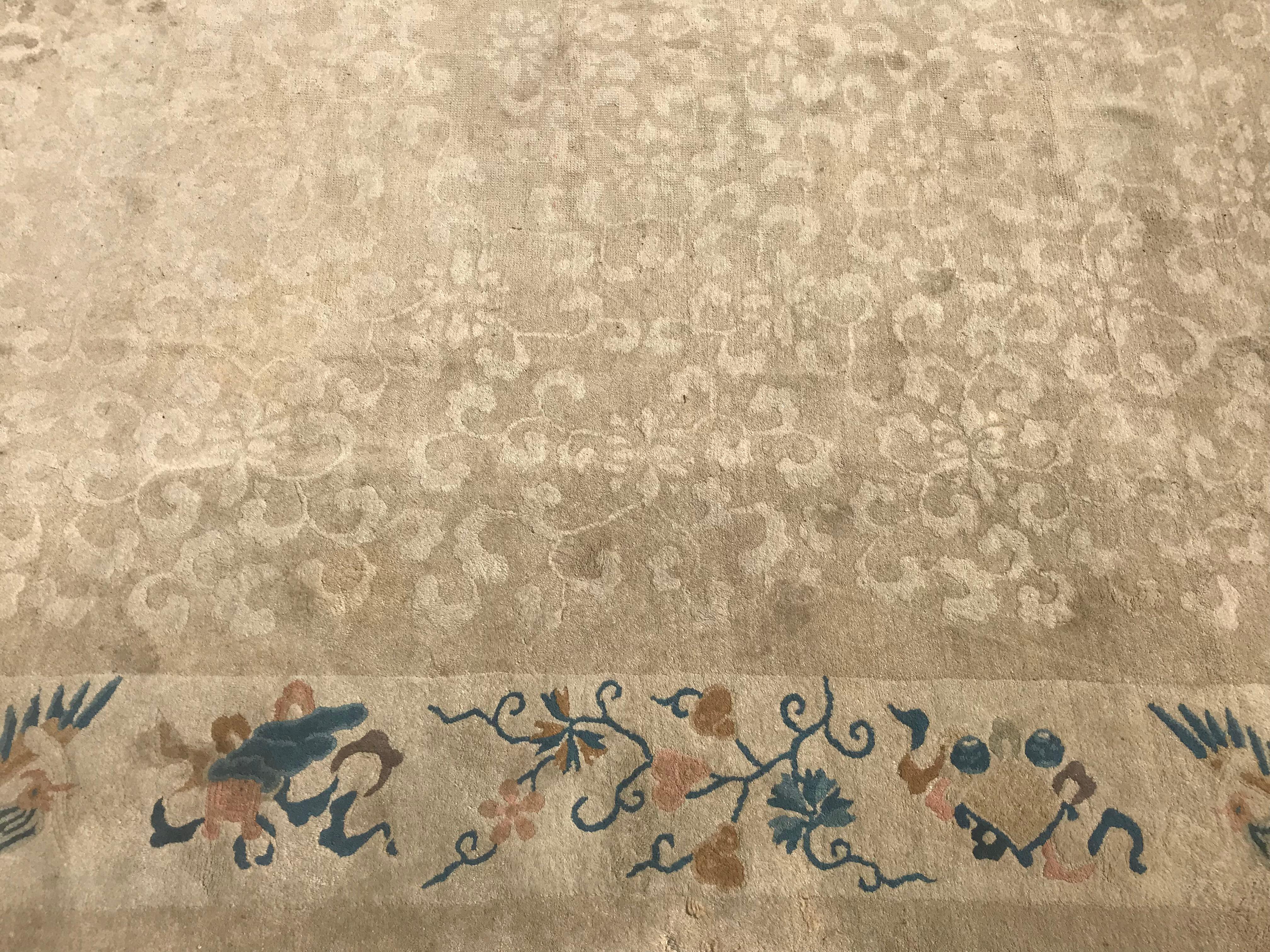Antique late 19th or early 20th century Chinese rug with a decorative Art Deco patterns and light colors entirely hand knotted, wool velvet on cotton foundation.

  